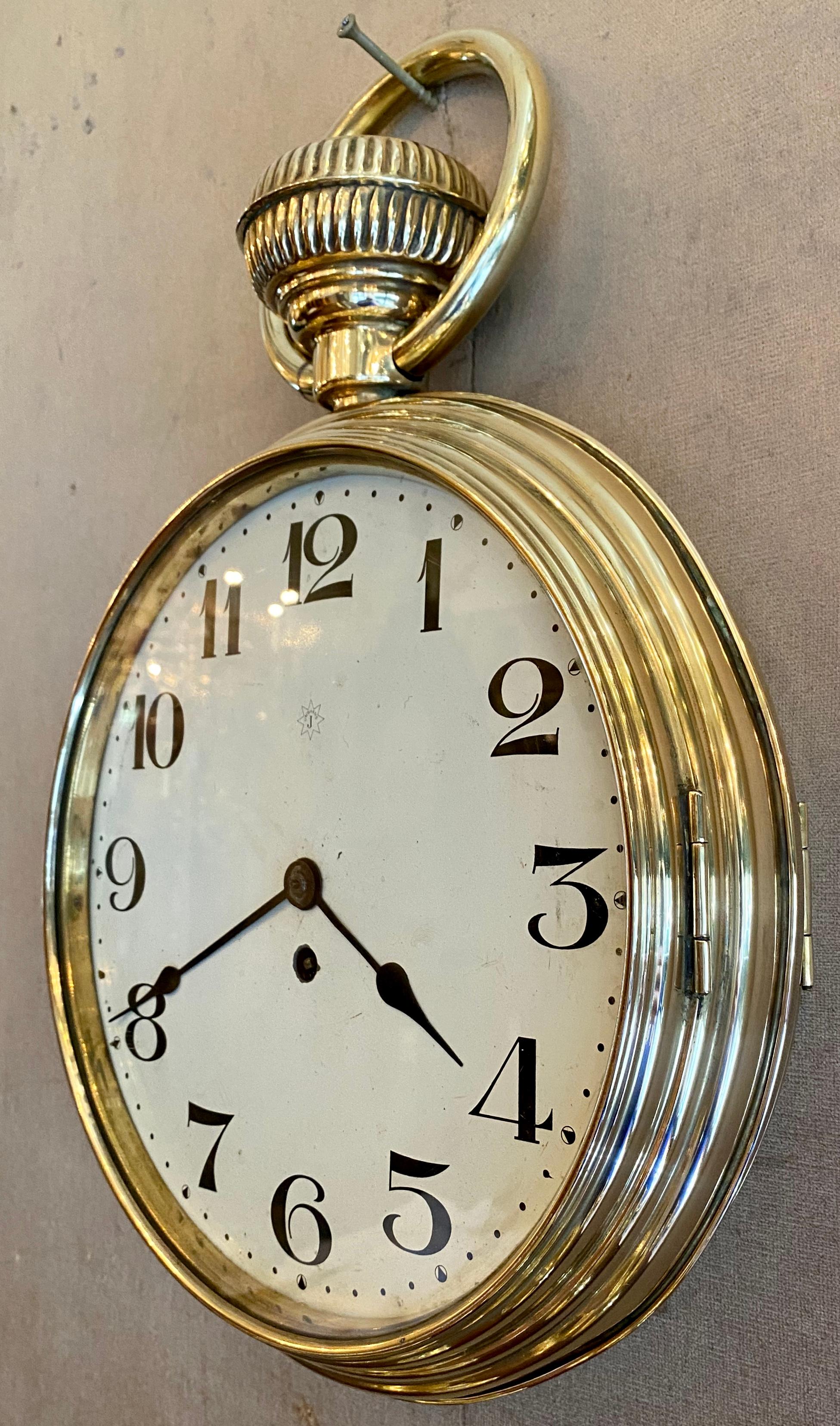 Antique brass wall clock in running order, pocket watch style, circa 1890-1900.
ECL044.