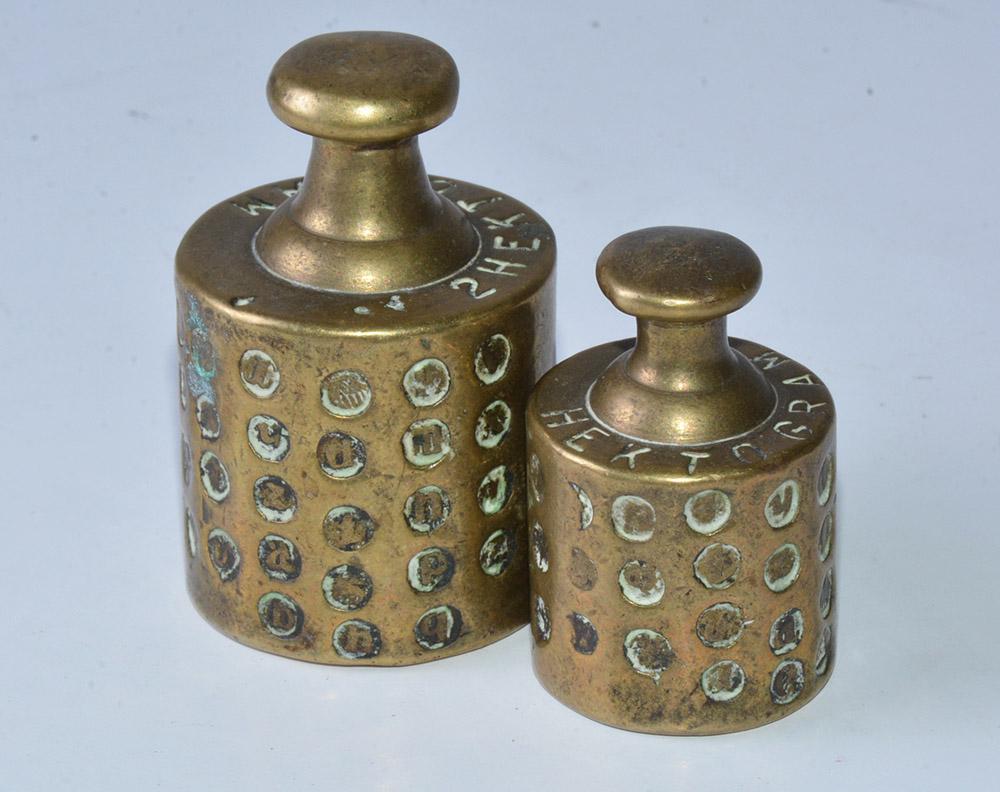 Antique brass scale weights very richly calibrated and marked. Stamps on the weights are an indication of regular inspections to verify the accuracy of the weights by an official inspector. Wonderful for any desk as paper weights or