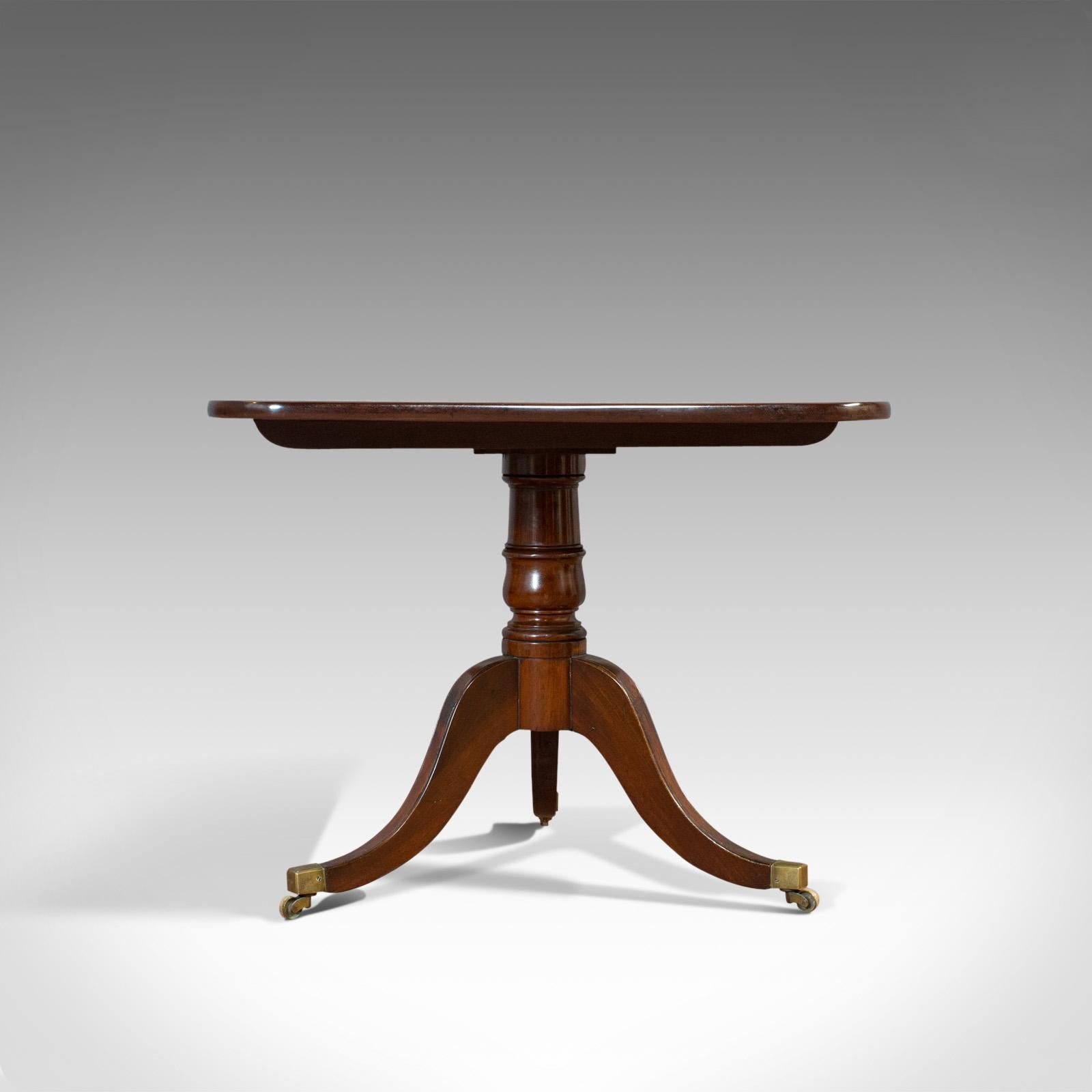 This is an antique breakfast table. An English, mahogany tilt-top dining table, dating to the Regency period, circa 1820.

Breakfast table of good proportion
Displays a desirable aged patina
Mahogany shows fine grain interest
Rich russet hues