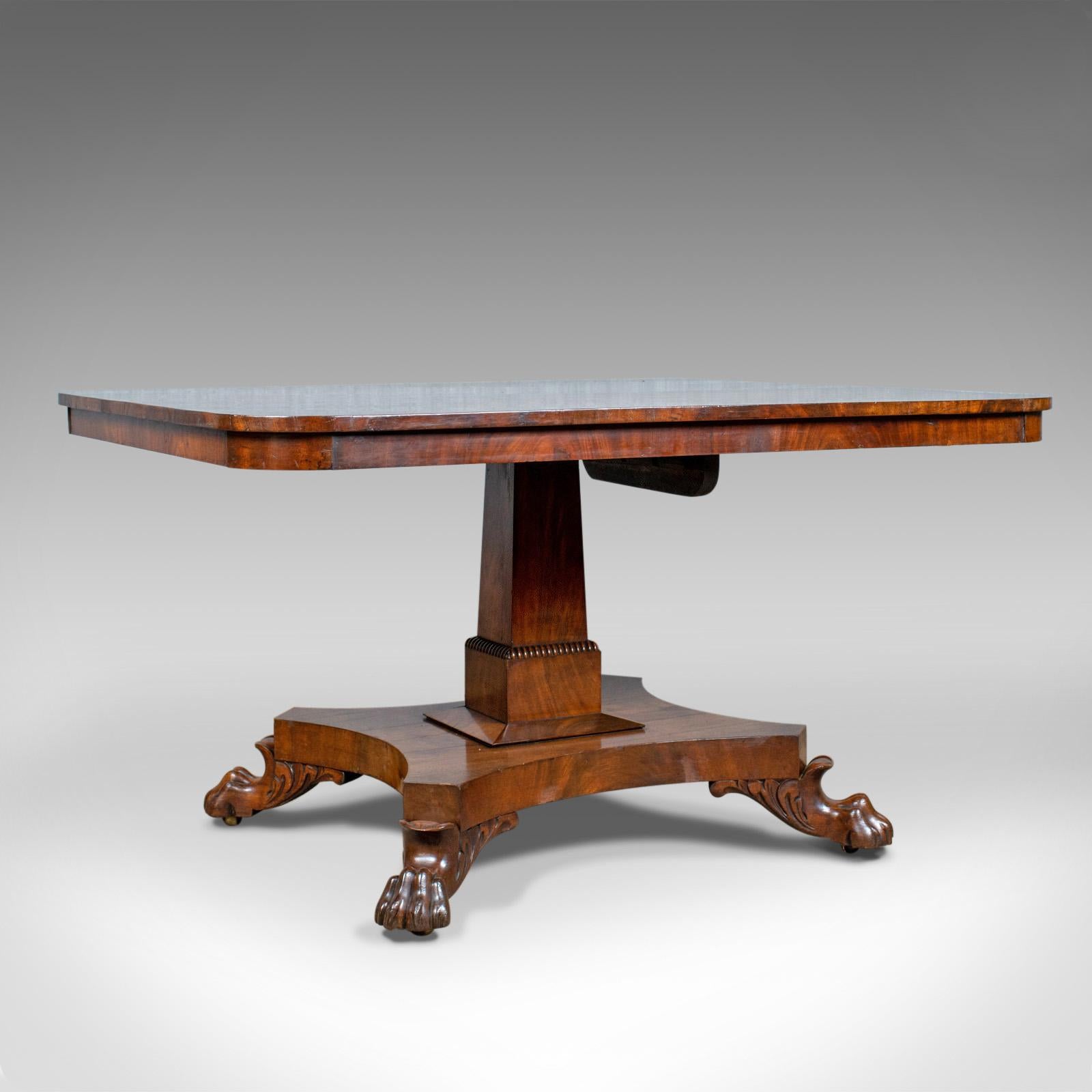 This is an antique breakfast table. An English, Regency, flame mahogany, tilt-top dining table dating to the early 19th century, circa 1830.

Attractive, bookmatched flame mahogany tabletop
Displaying grain interest and a desirable aged