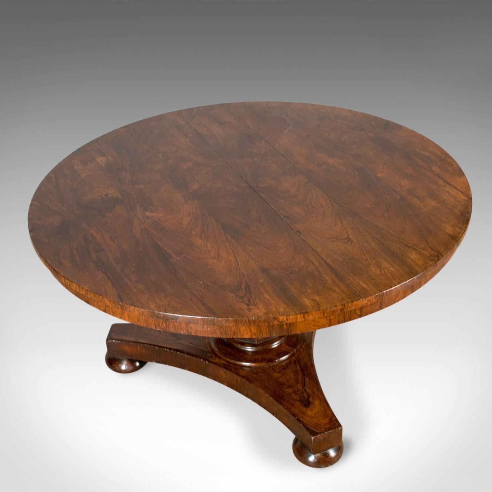 This is an antique breakfast table, an English, Regency, rosewood dining table dating to circa 1820.

A fine example with good proportion
Attractive grain detail in the lustrous wax polished finish
Desirable aged patina
Crossbanded rosewood