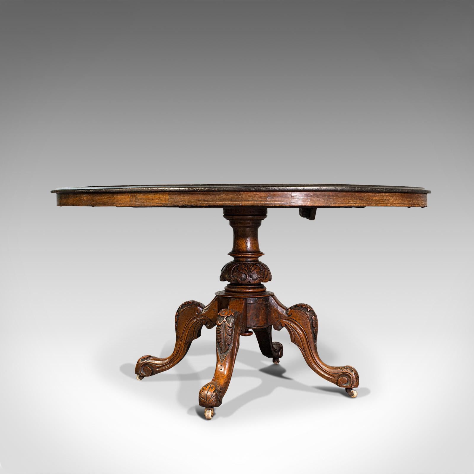 This is an antique breakfast table. An English, walnut over mahogany tilt-top oval table, dating to the Victorian period, circa 1870.

Beautifully appointed Victorian table
Displays a desirable aged patina - in good original order