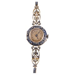 Bracelet montre Brevett ancien en or jaune émaillé et diamants