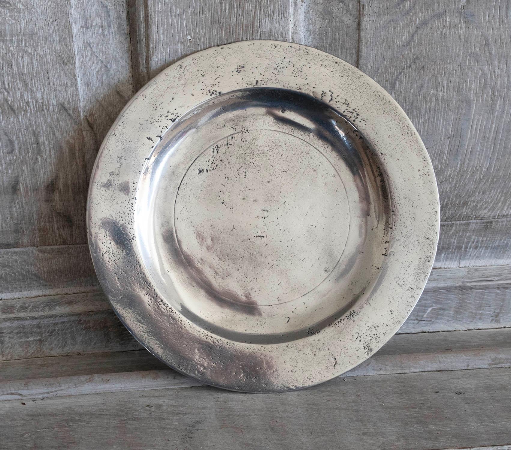 Lovely highly polished pewter plate.

Evidence of a rubbed touchmark on the underside. London maker

The pewter has been polished to its original shine to imitate polished silver. It was known as the Poor Man's Silver.

The great thing about