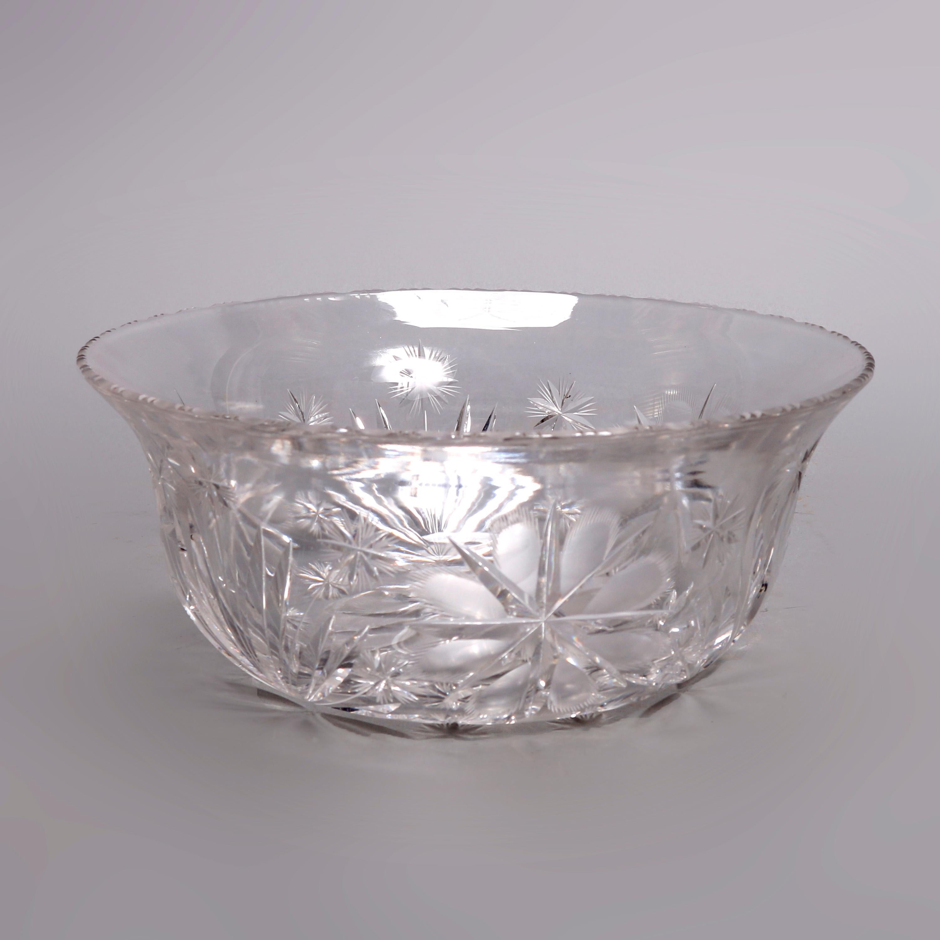 An antique brilliant cut glass serving bowl offers flared form with floral and foliate cut decoration and star base, 20th century

Measures: 4.5