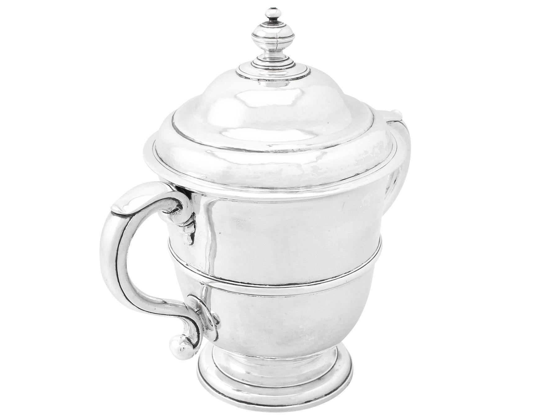 An exceptional, fine and impressive antique William III English Britannia standard silver cup and cover; an addition to our 17th century silverware collection

This fine antique William III Britannia standard* silver cup and cover has a plain bell