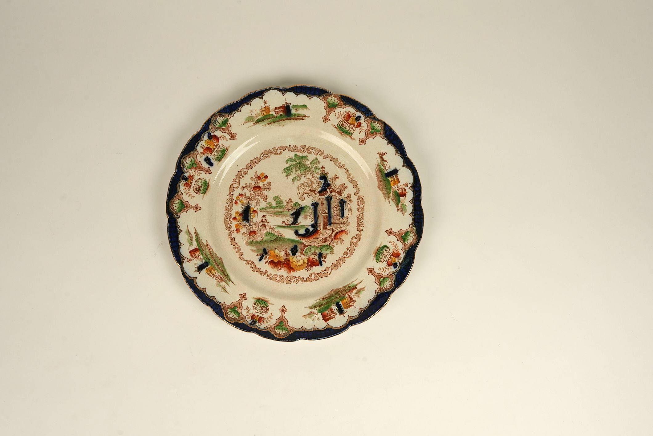 A striking example of late 19th-century British ceramics, this British Anchor Pottery ‘Japan’ plate captures the imagination with its vibrant palette and ornate detailing inspired by Japanese Imari ware. Made of durable ironstone, the plate is