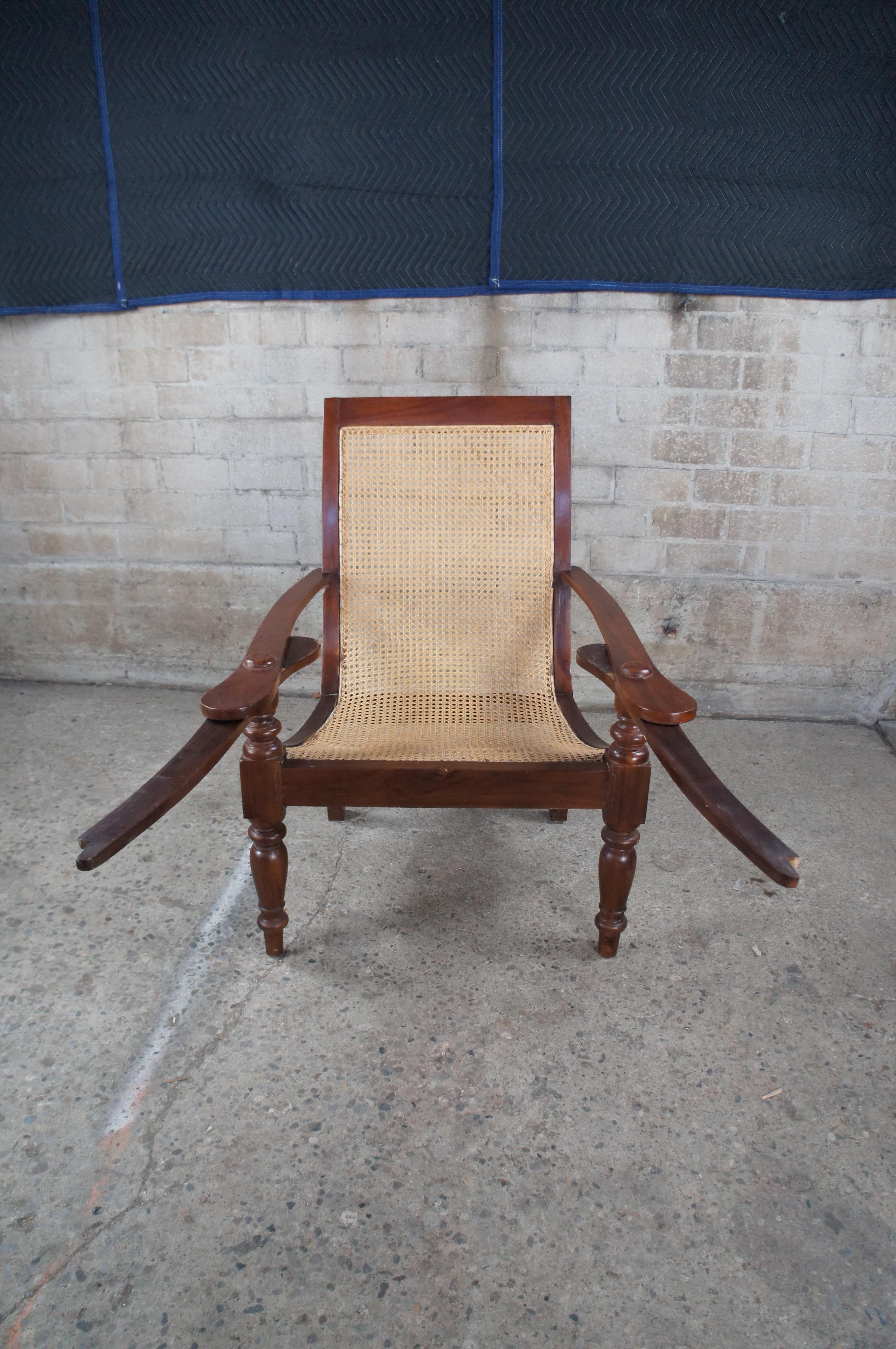 20th Century Antique British Colonial Anglo Indian Teak Extendable Arm Caned Plantation Chair