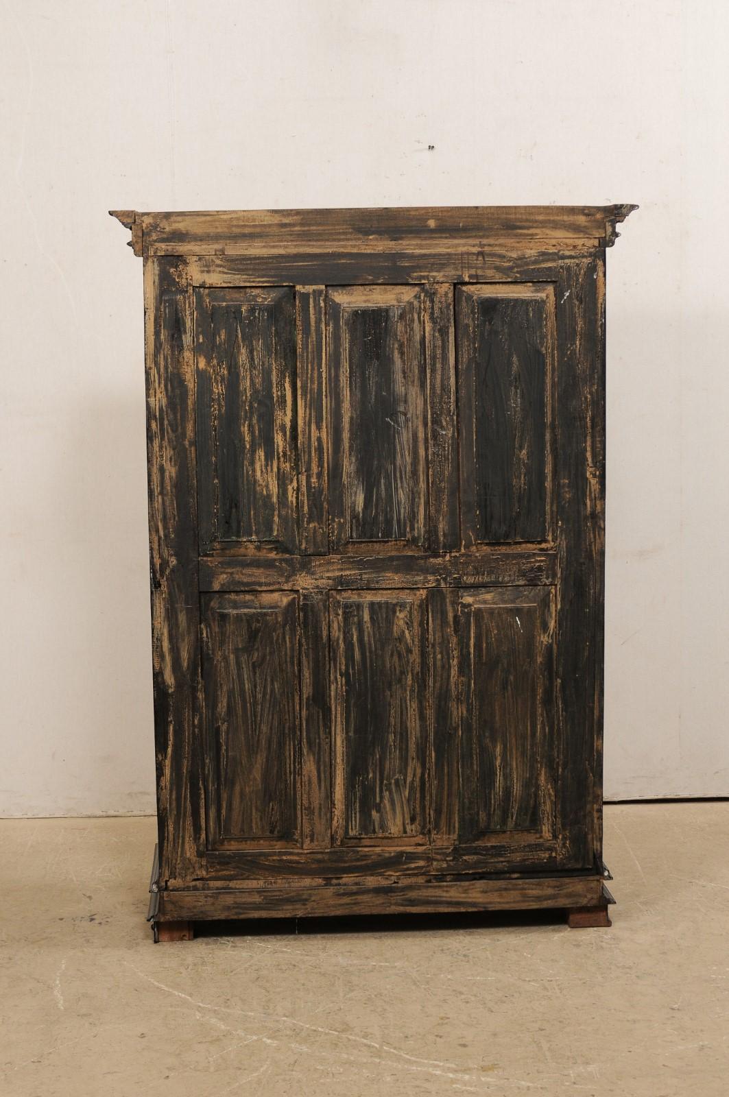 20th Century Antique British Colonial Black Armoire Cabinet with Raised Oval-Panel Doors For Sale