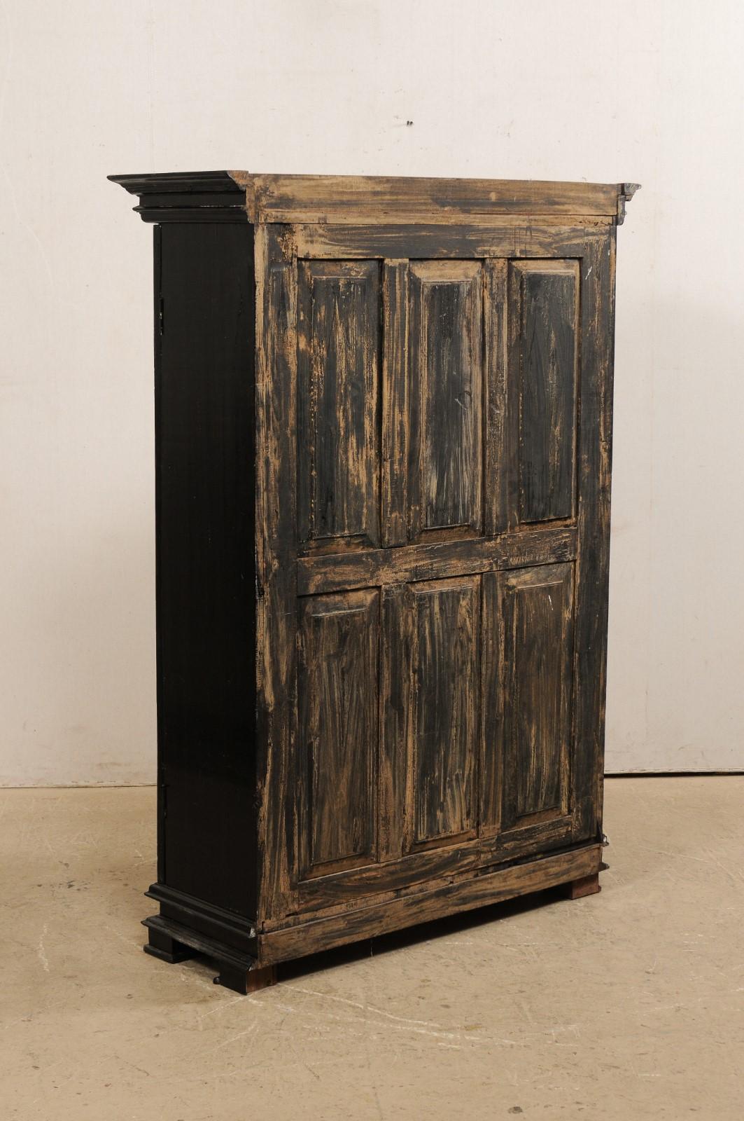 Wood Antique British Colonial Black Armoire Cabinet with Raised Oval-Panel Doors For Sale