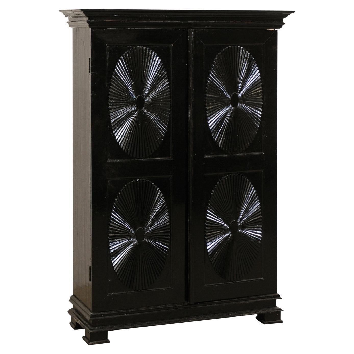 Antique British Colonial Black Armoire Cabinet with Raised Oval-Panel Doors For Sale