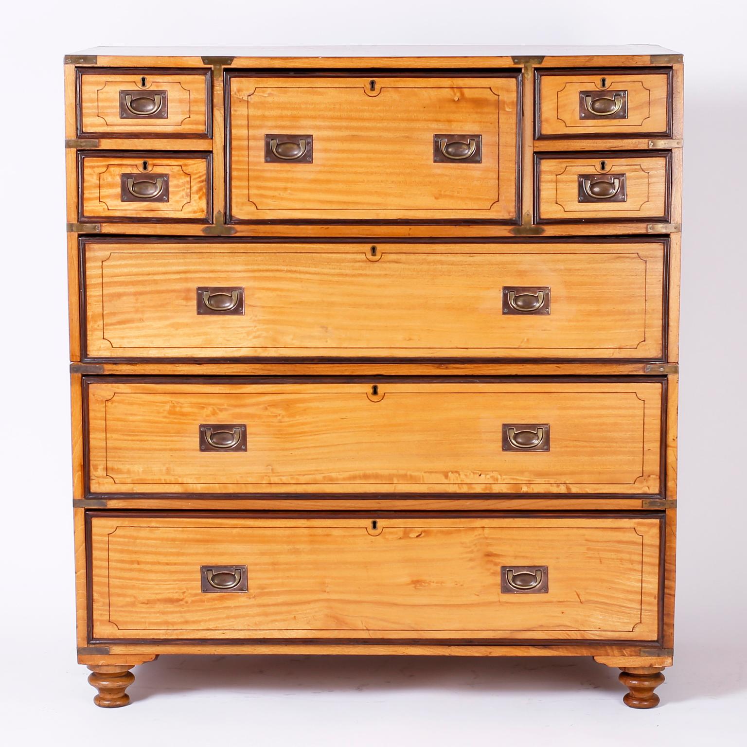 Impressive 19th century campaign chest with seven drawers handcrafted in camphor wood and featuring a pullout desk with nooks, drawers and a leather writing surface.