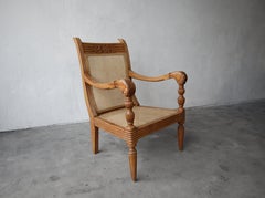 Antique British Colonial Cane and Carved Teak Lounge Chair