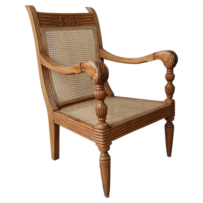 Antique British Colonial Cane and Carved Teak Lounge Chair For Sale at
