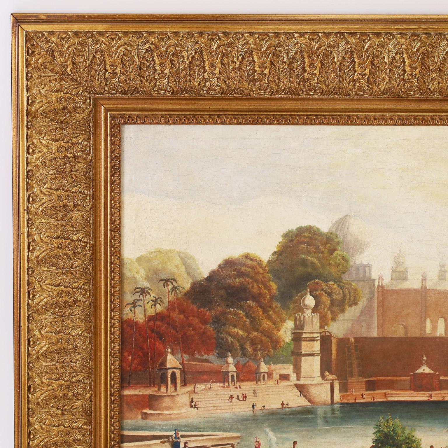 Intriguing 19th century British Colonial oil painting on canvas of an Indian Palace and all the everyday things that go on around it, in a setting with palm trees and mountains. Indistinctly signed in the lower left, dated 1892 and presented in a