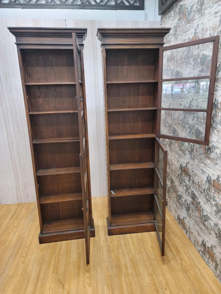 Antique Thai British Colonial Teak and Glass Display Cabinet - Pair

This british colonial tall and thin display cabinet has 5 shelves and 2 glass doors. Made of teakwood from Thailand these cabinets can be used to display small tea cups and