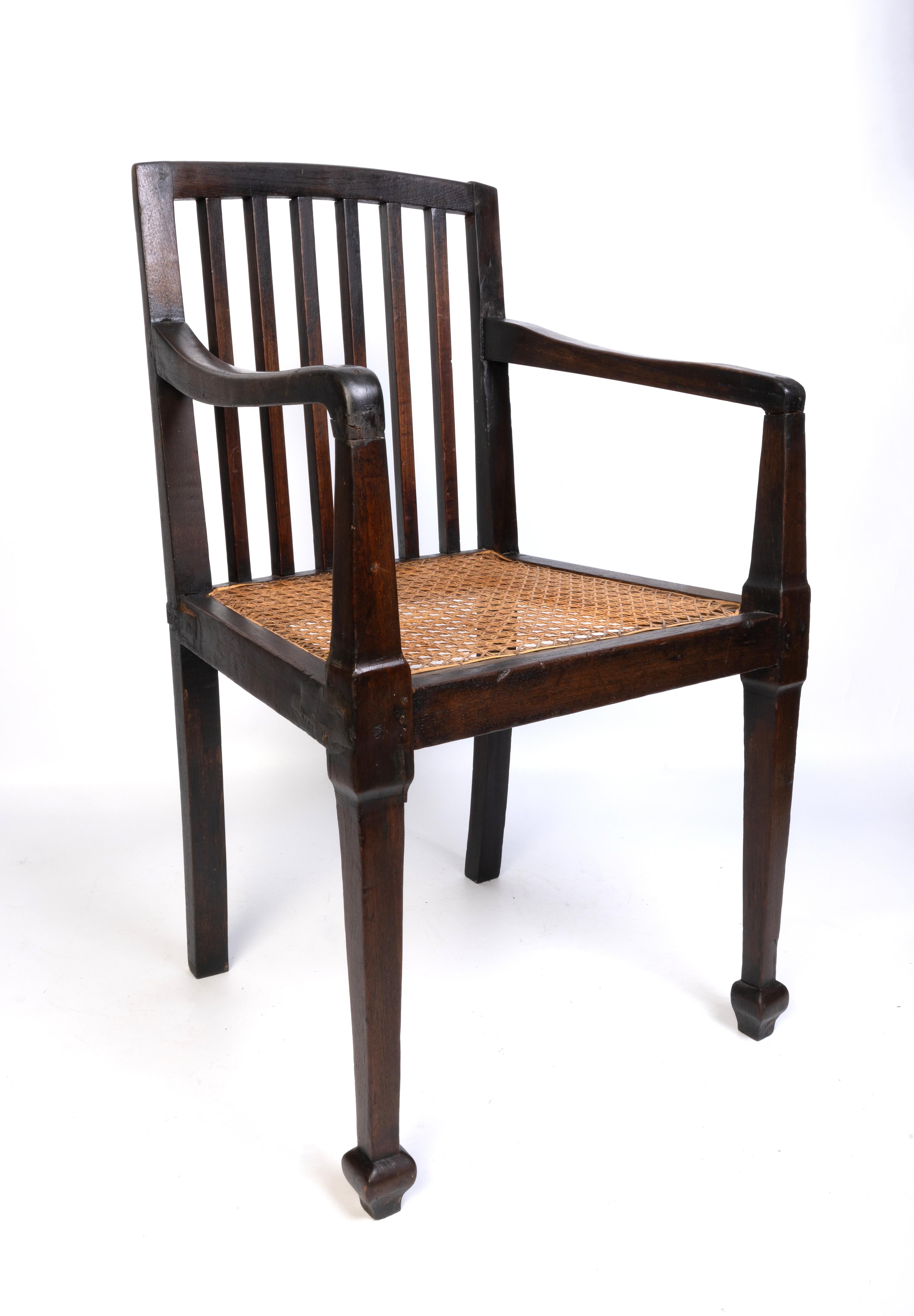 Antique British Colonial Teak and Rattan Hall Elbow Chair, C. 1900

Good solid construction with historic repairs (please refer to photos).

Please message for a specific destination quote.