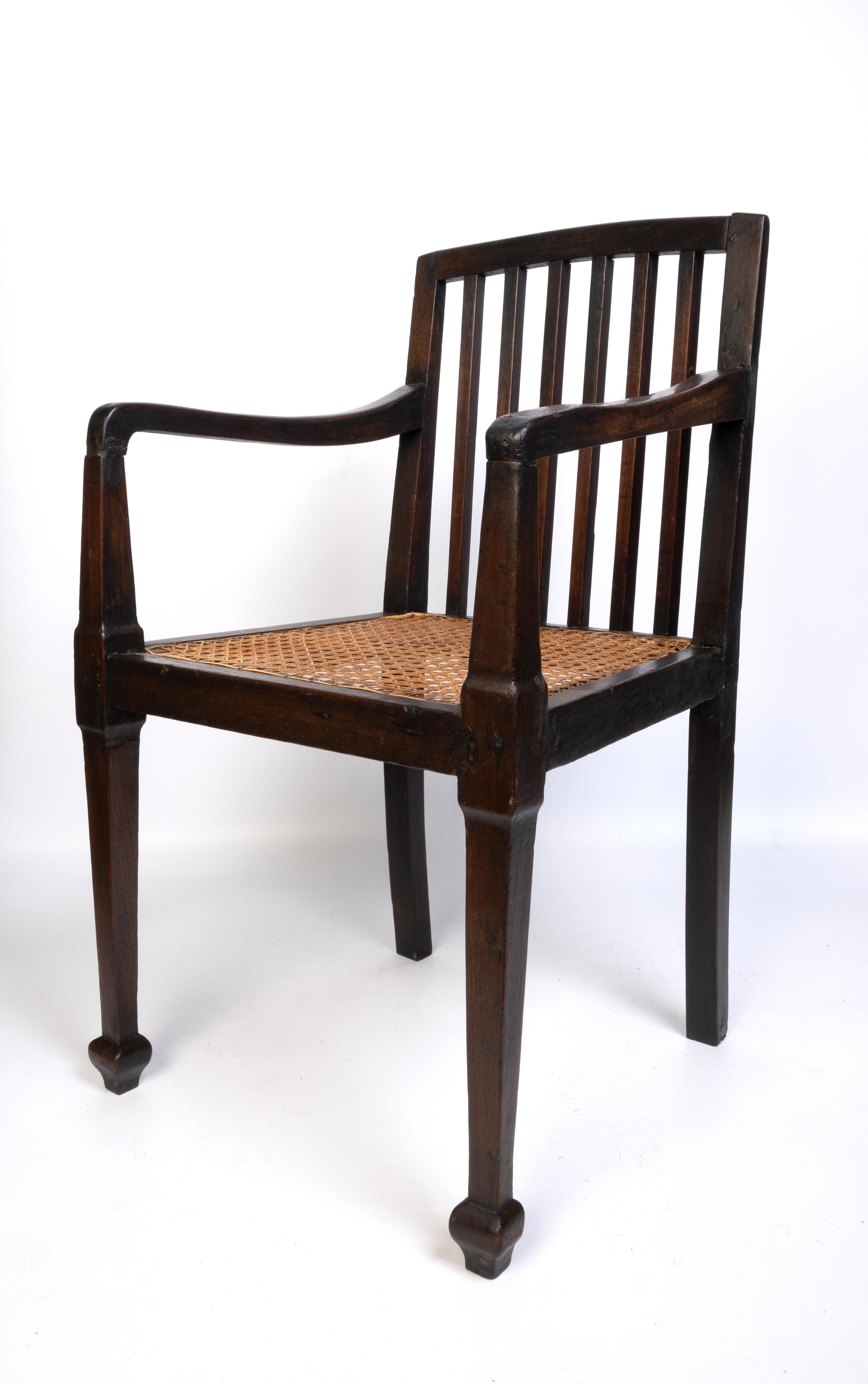 Indian Antique British Colonial Teak and Rattan Hall Elbow Chair, C. 1900 For Sale