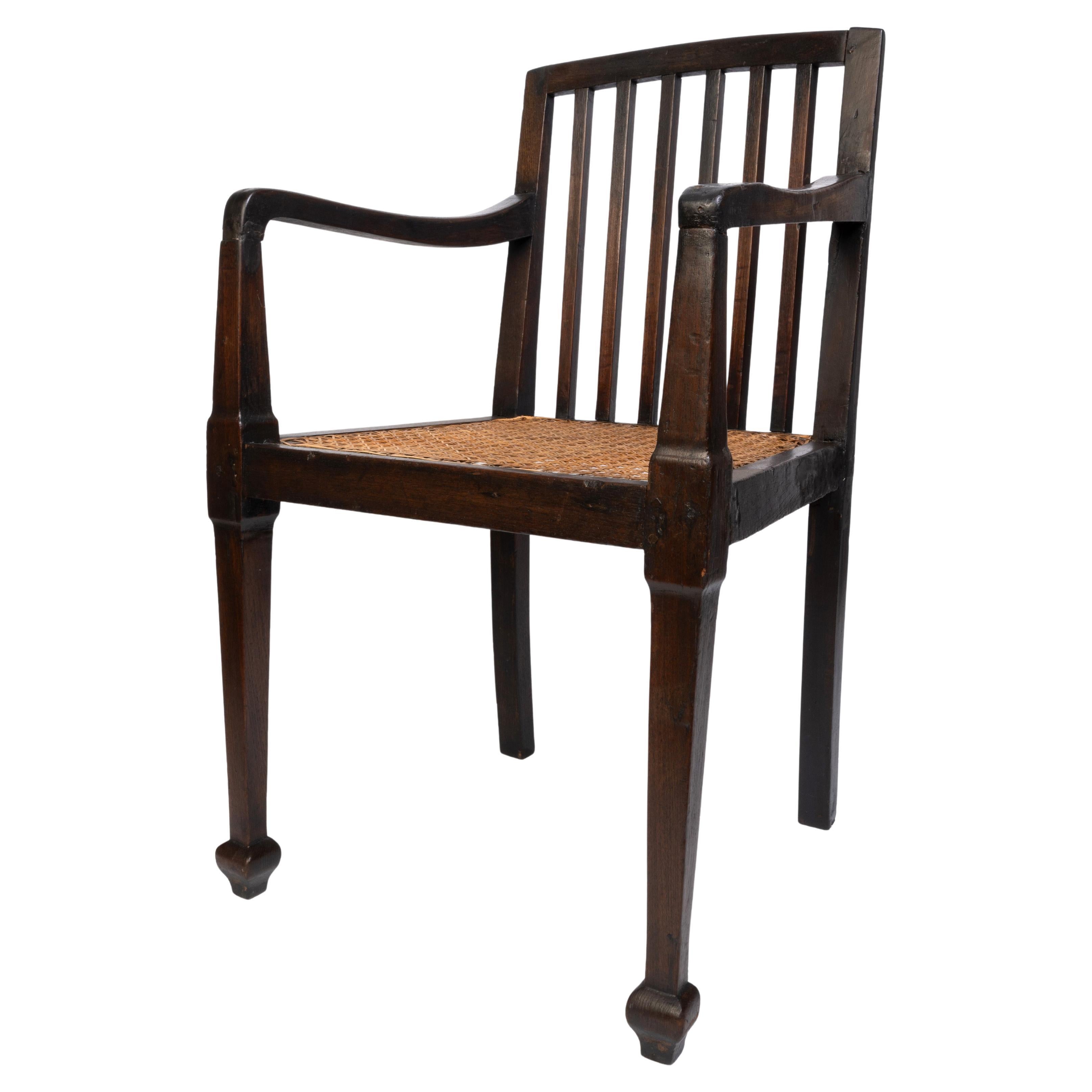Antique British Colonial Teak and Rattan Hall Elbow Chair, C. 1900 For Sale