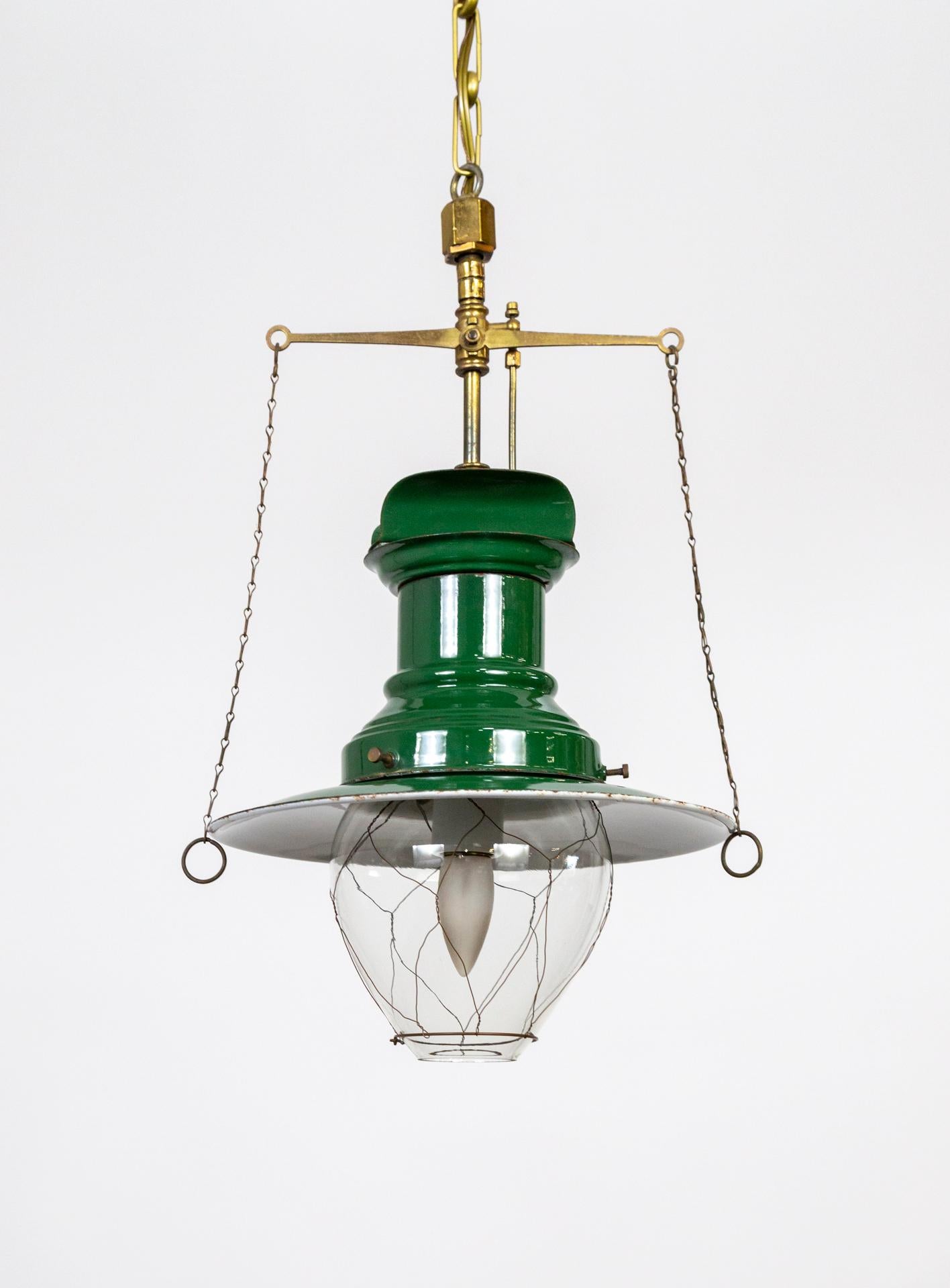 An antique, brass, green and white enameled, nautical lantern; with a wire caged, glass shade. Originally gas, now newly wired to electric. New chain and canopy. 11.5