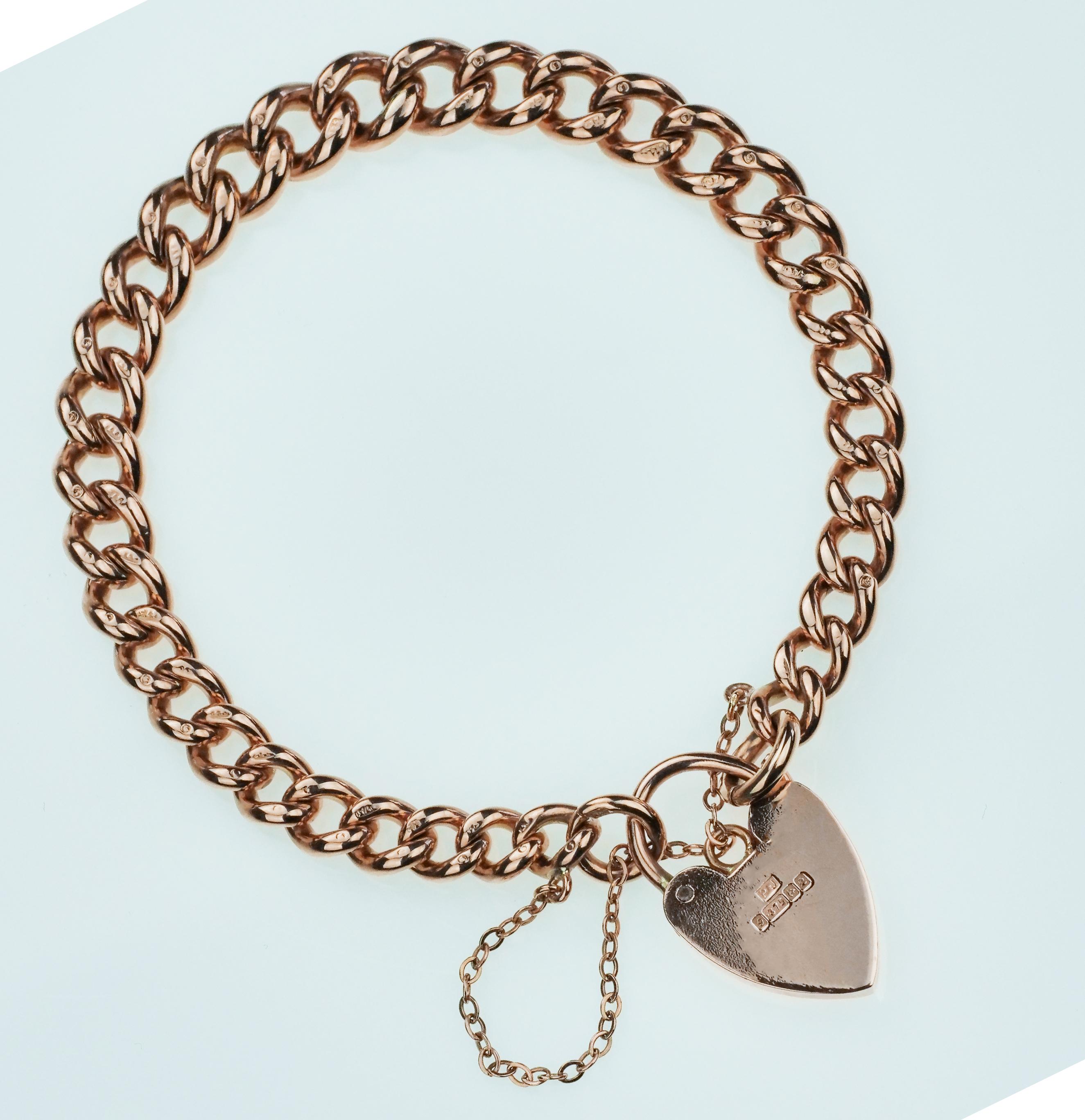 Rose gold chain bracelet with a heart padlock. It consists of chunky solid links of gorgeous seamlessly smooth rose gold curb link bracelet and British hallmarked on every single link. With a heart padlock which seals the open ends of the bracelet