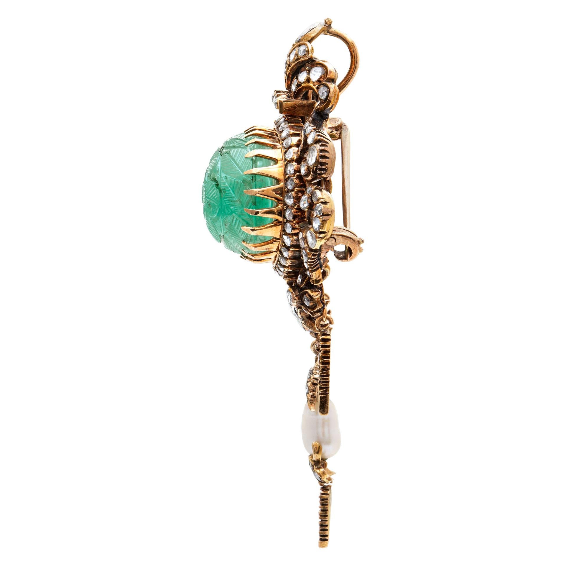 ESTIMATED RETAIL: $12,600 YOUR PRICE: $8,340 - Antique Broach/Pendant with an over 40 carat carved emerald cabochon accented with rose & cushion cut diamonds set in 14K yellow gold. One natural pear shape natural pearl. 75mm height (including