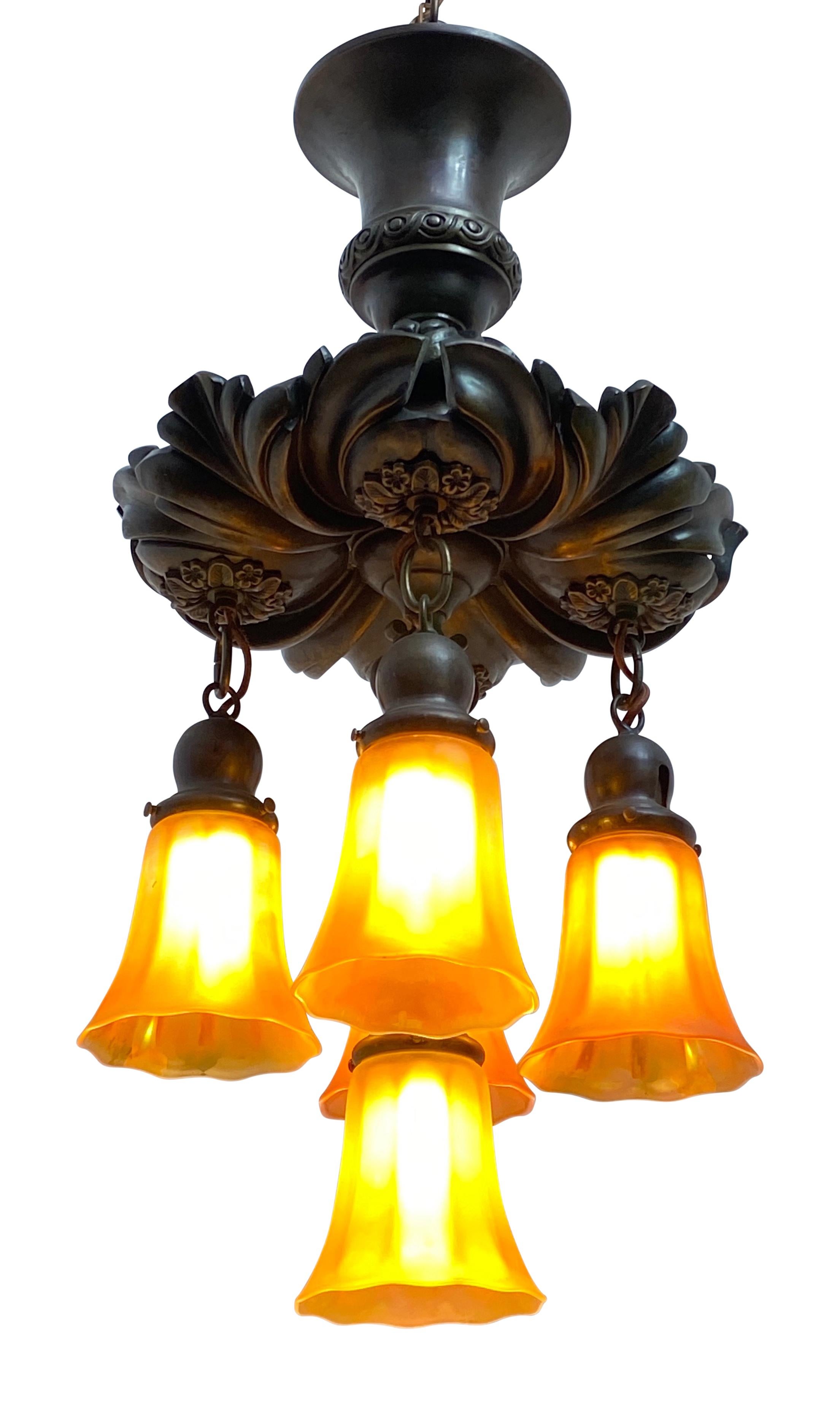 High quality cast bronze flushmount light fixture with six iridescent amber color art glass shades.
American, early 20th century, circa 1920.
Newly re-wired.