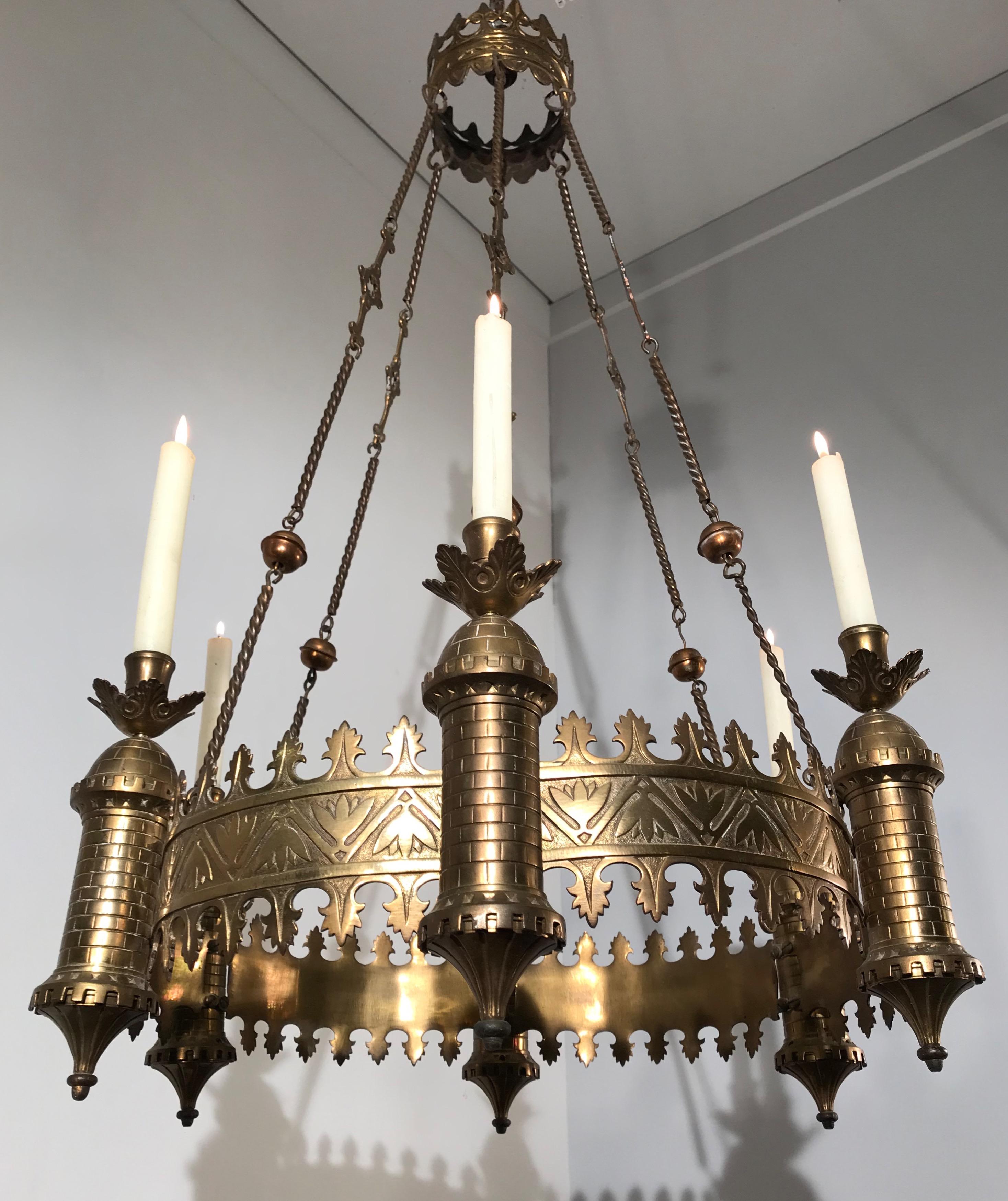 Stunning and handcrafted, medieval castle theme pendant from the late 1800s.

This candle chandelier from the 1880s is another one of our recent great finds. This Gothic Revival chandelier shows that in the late 1800s many of the pieces that were