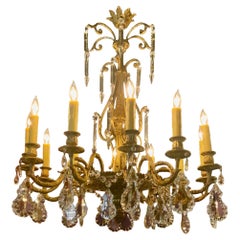 Antique Bronze and crystal twelve light chandelier
