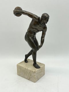 Antique bronze athlete as discus thrower