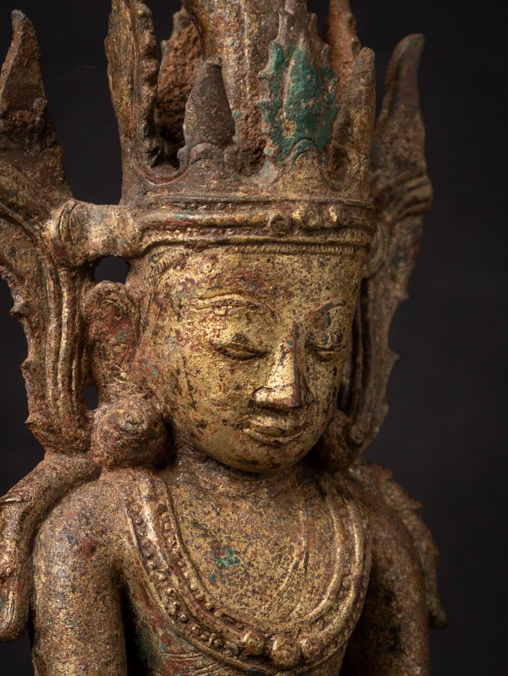 Material: bronze
32,6 cm high 
16 cm wide and 9 cm deep
Weight: 2.757 kgs
With traces of 24 krt. gilding
Ava style
Bhumisparsha mudra
Originating from Burma
15th century, early Ava period
A very special bronze Buddha with one of the best expressions