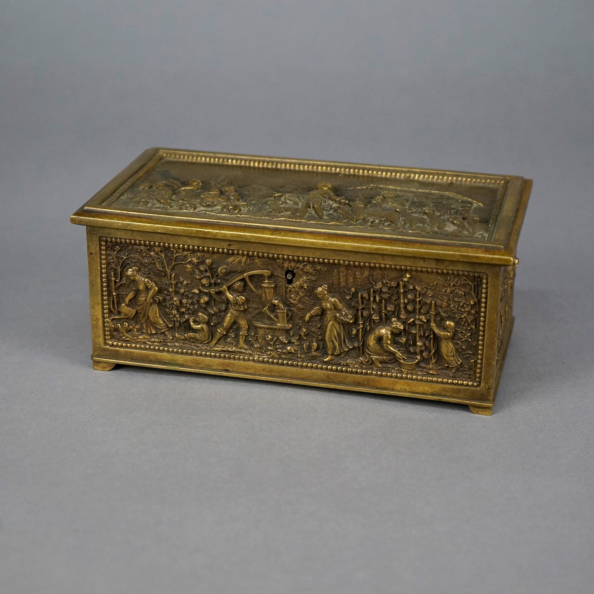 An antique dresser box offers cast bronze construction with high relief Continental village genre scene having figures, farm animals, and structures in outdoor countryside setting, 19th century

Measures- 3.25''H x 8''W x 4''D.