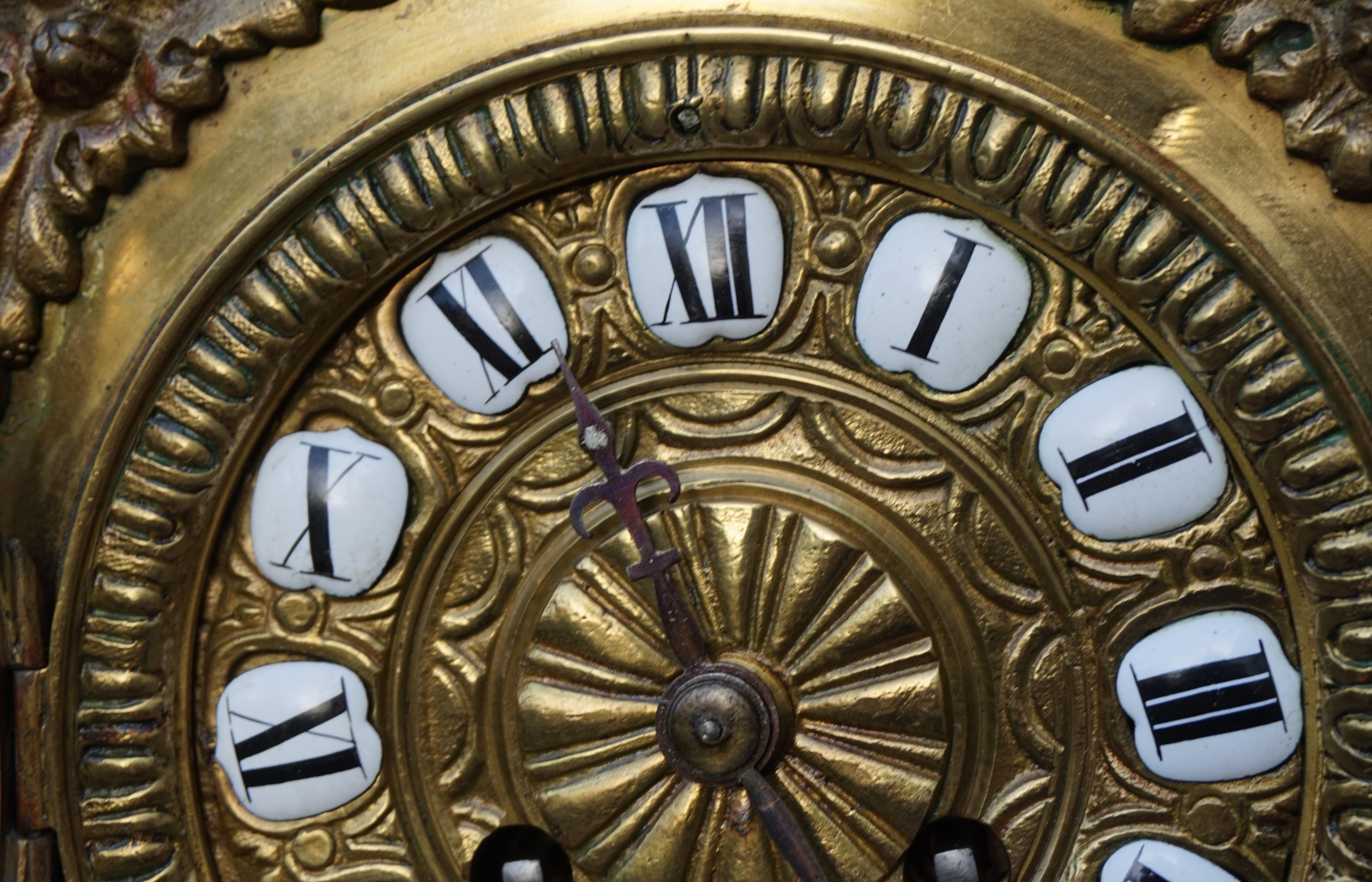 Antique Bronze and Brass Mantel Clock, Enameled Roman Numerals, Lion Sculptures In Good Condition For Sale In Lisse, NL