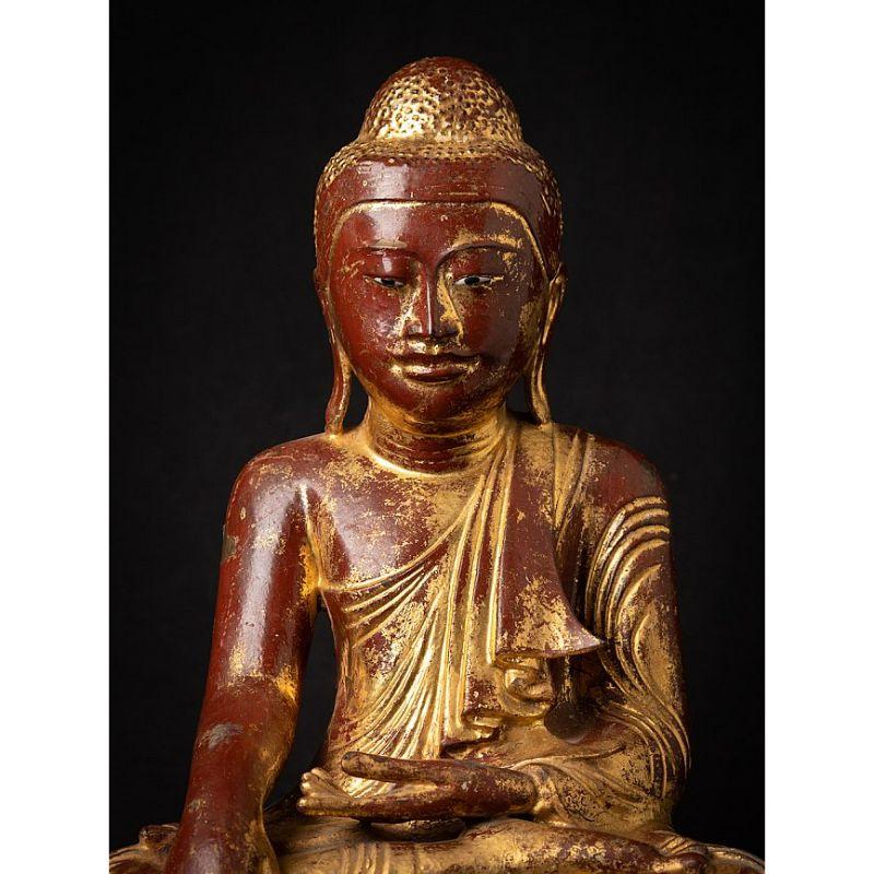 Material: bronze
Measures: 44,5 cm high 
36 cm wide and 24,1 cm deep
Weight: 11 kgs
Gilded with 24 krt. gold
Mandalay style
Bhumisparsha mudra
Originating from Burma
19th century
With inlayed eyes.

