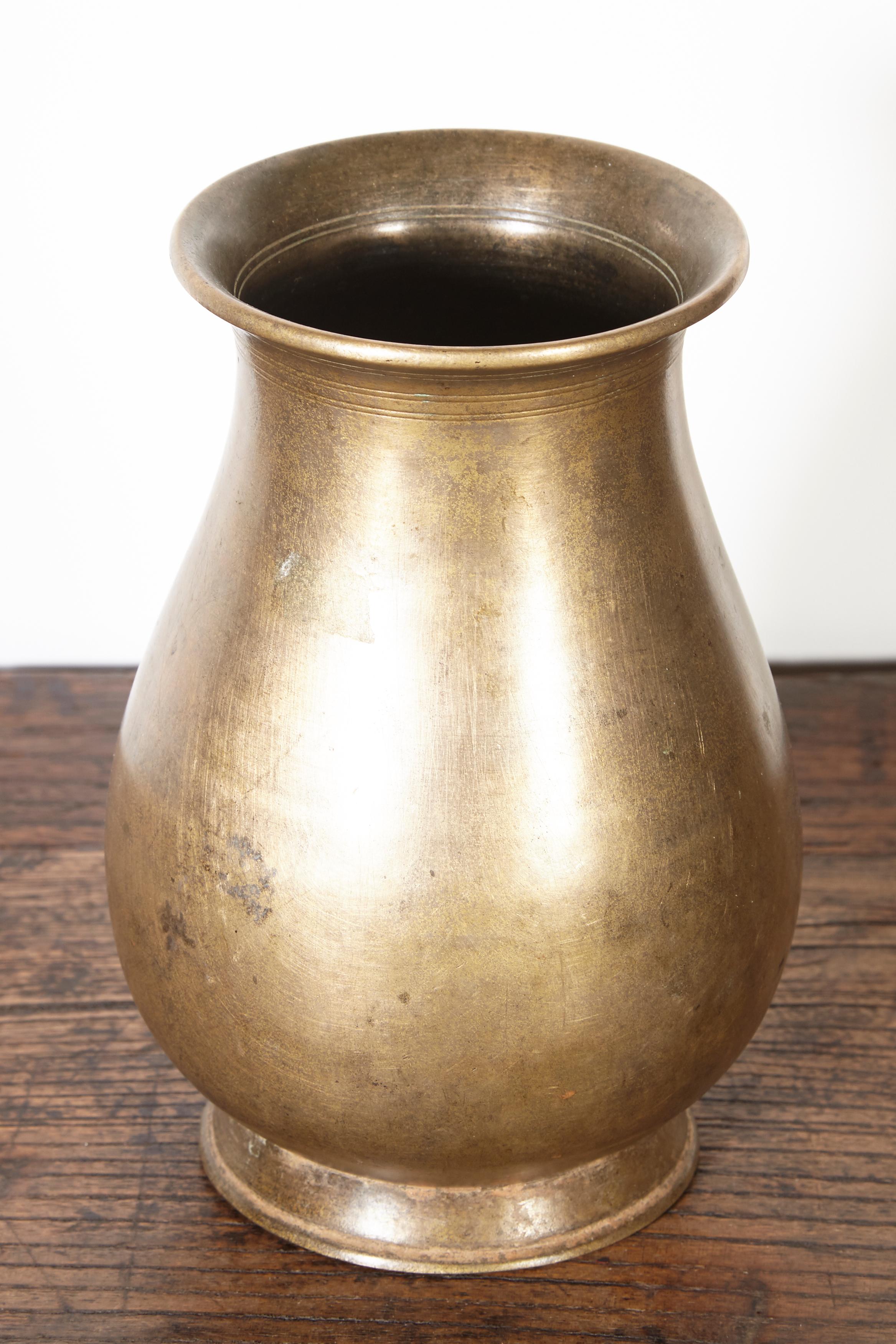 A tall and very graceful bronze ceremonial holy water vessel from Nepal, with great patina and spiritual presence.
M2033.