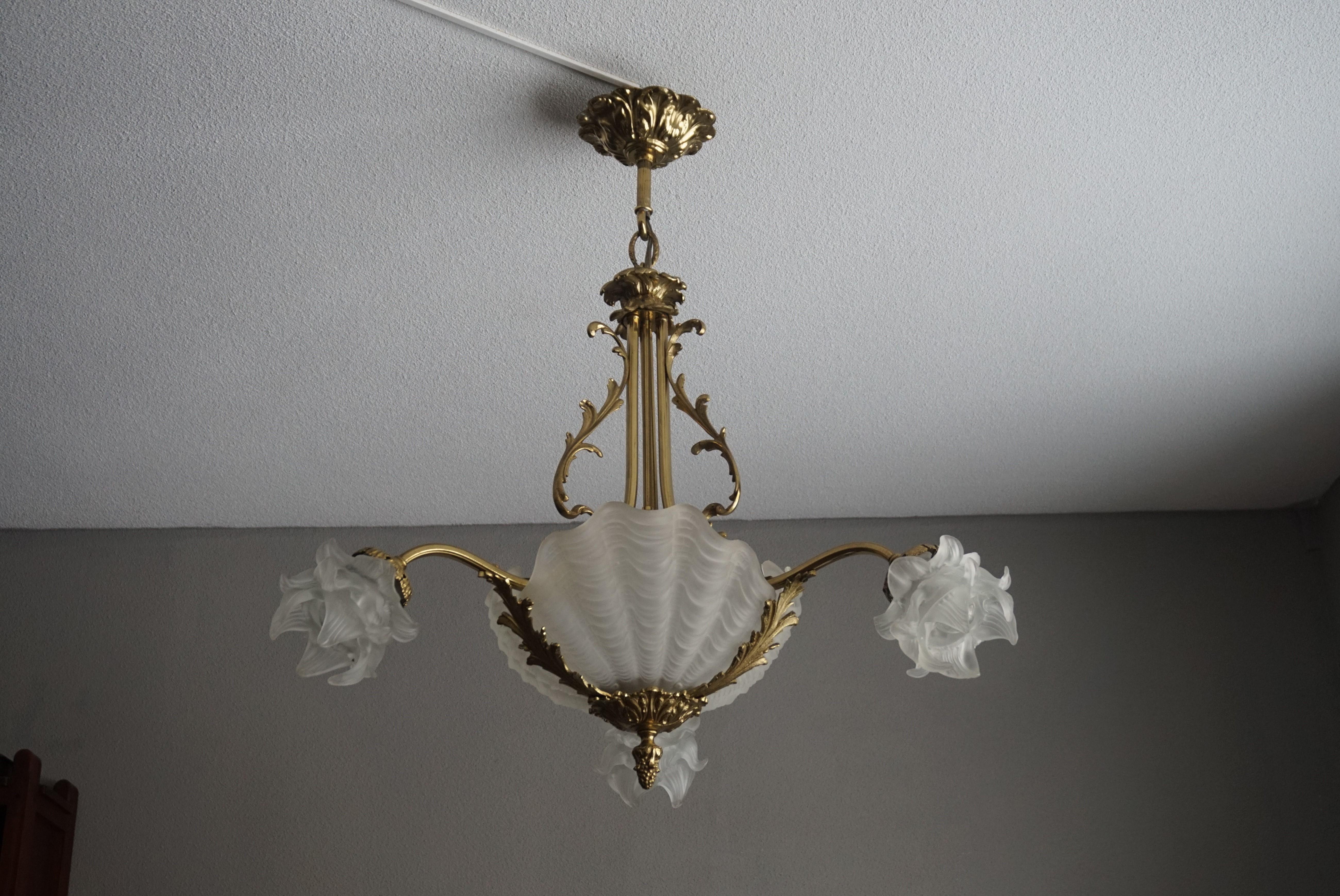 Elegant and simply beautiful, ocean-life-theme chandelier.

When you look at early 20th century lighting then it seems like the artists/designers were inspired by all the beauty that we were discovering in the world. This appreciation for everything