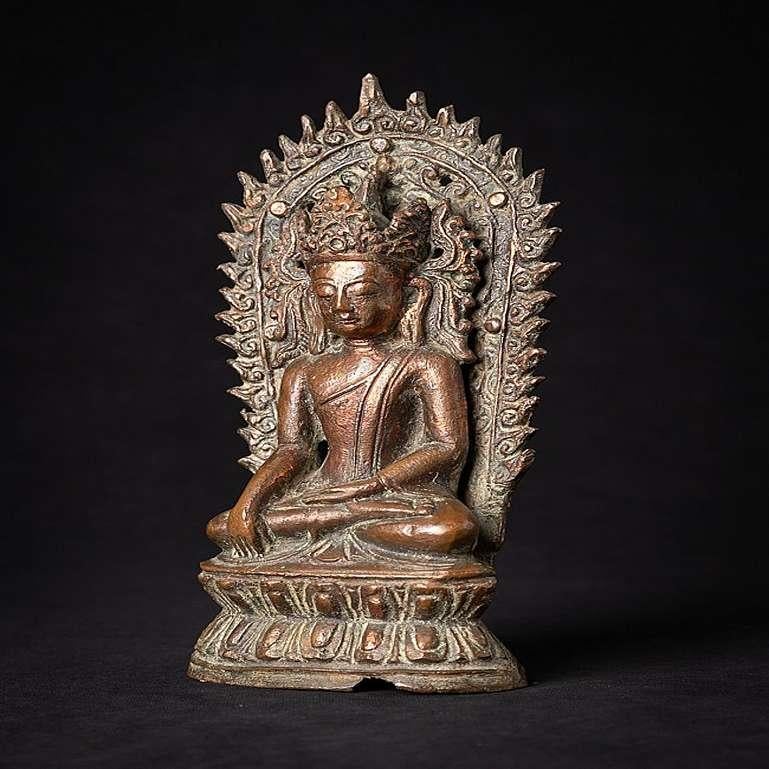 Material: bronze
Measures: 22,6 cm high 
11,1 cm wide and 5,2 cm deep
Weight: 0.853 kgs
Arakan style
Bhumisparsha mudra
Originating from Burma
14-15th century
With high copper content in the bronze aloy
Very special !

