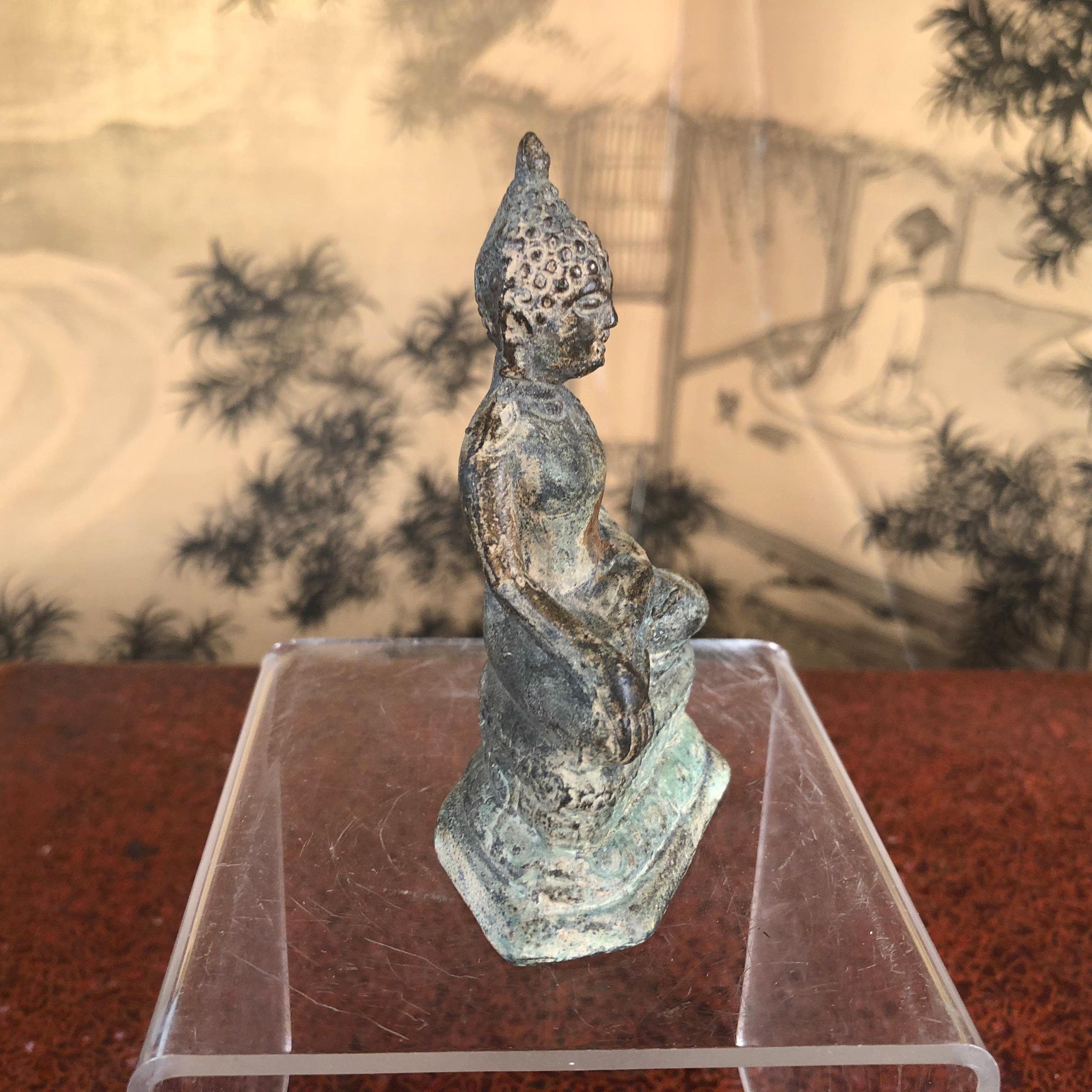 small bronze buddha statue