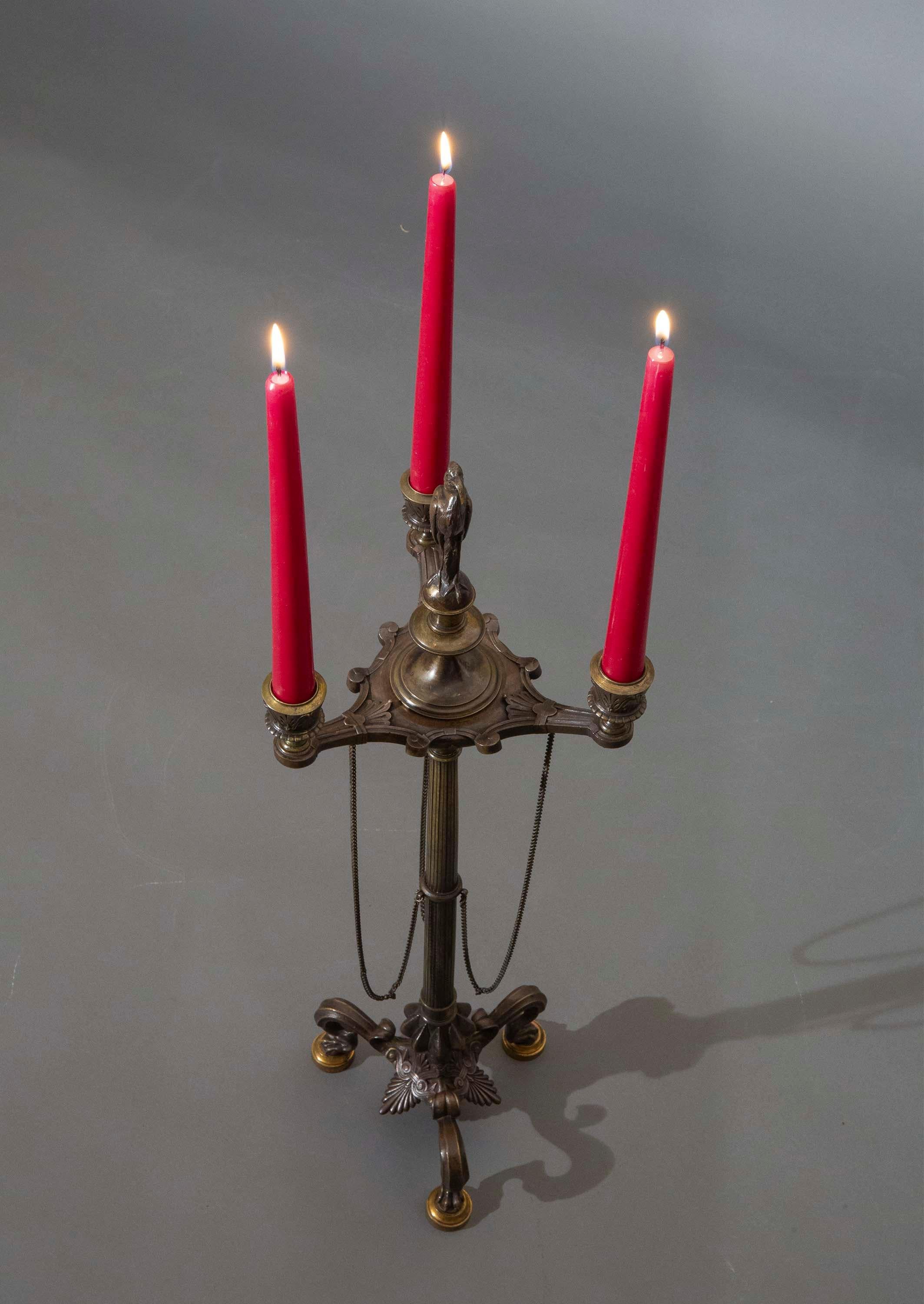 An exquisitely cast and patinated bronze 'Etruscan' candelabrum in the Grand Tour taste.
France or Italy, mid- to late 19th century.

Why we like it
We love the finest quality of casting and patination on this superb candelabrum. The top part,