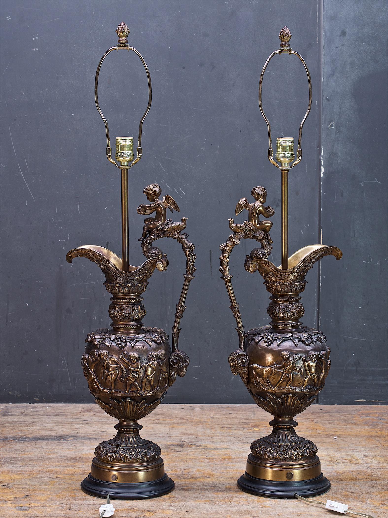 A pair of very heavy bronze lamps. New Sockets and wiring, line switches, plugs. US standard plugs. Includes original matching bronze finials. The shades are soiled and not included, but if you want them let me know, they will have to be shipped