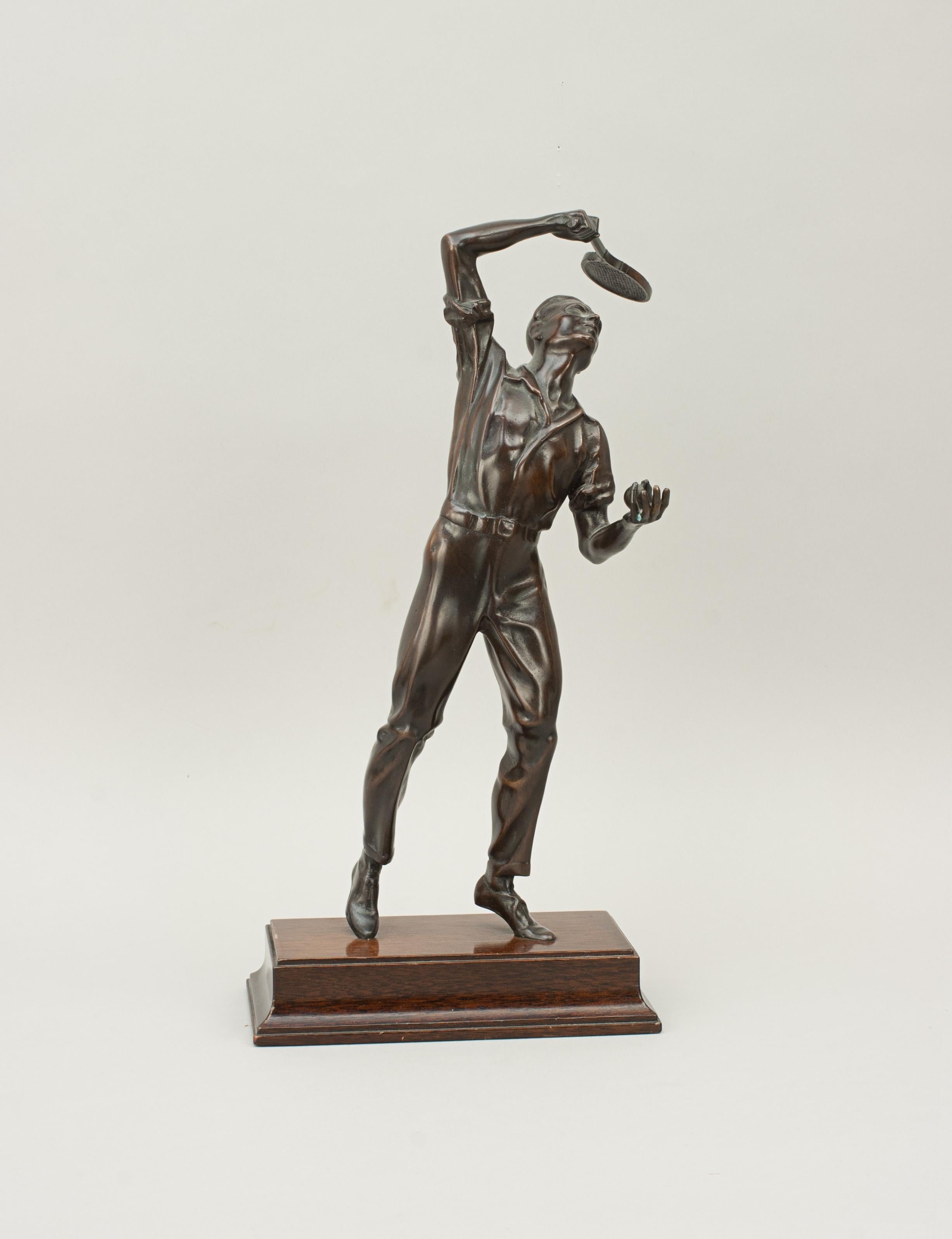 Bronze tennis player statue.
Vintage bronze male tennis player figure mounted onto a mahogany plinth. The tennis player is in mid-serve and is highly detailed especially the head. The gentleman tennis player is wearing a short-sleeved shirt and long