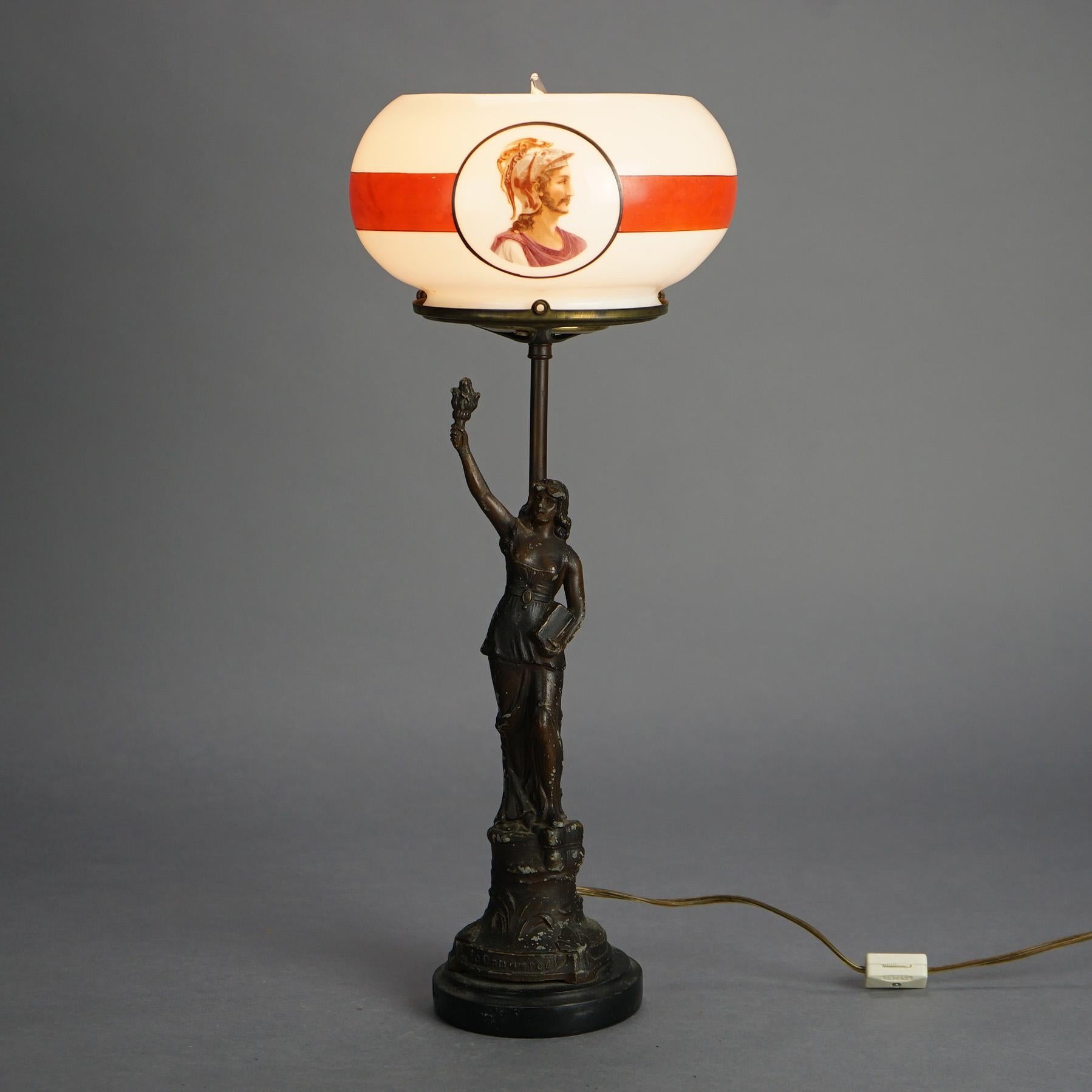 Antique Bronze Finished Figural Table Lamp with Woman, Book & Torch and having Portrait Glass Shade; Germany on Base, C1910

Measures- 19''H x 7.5''W x 7.5''D