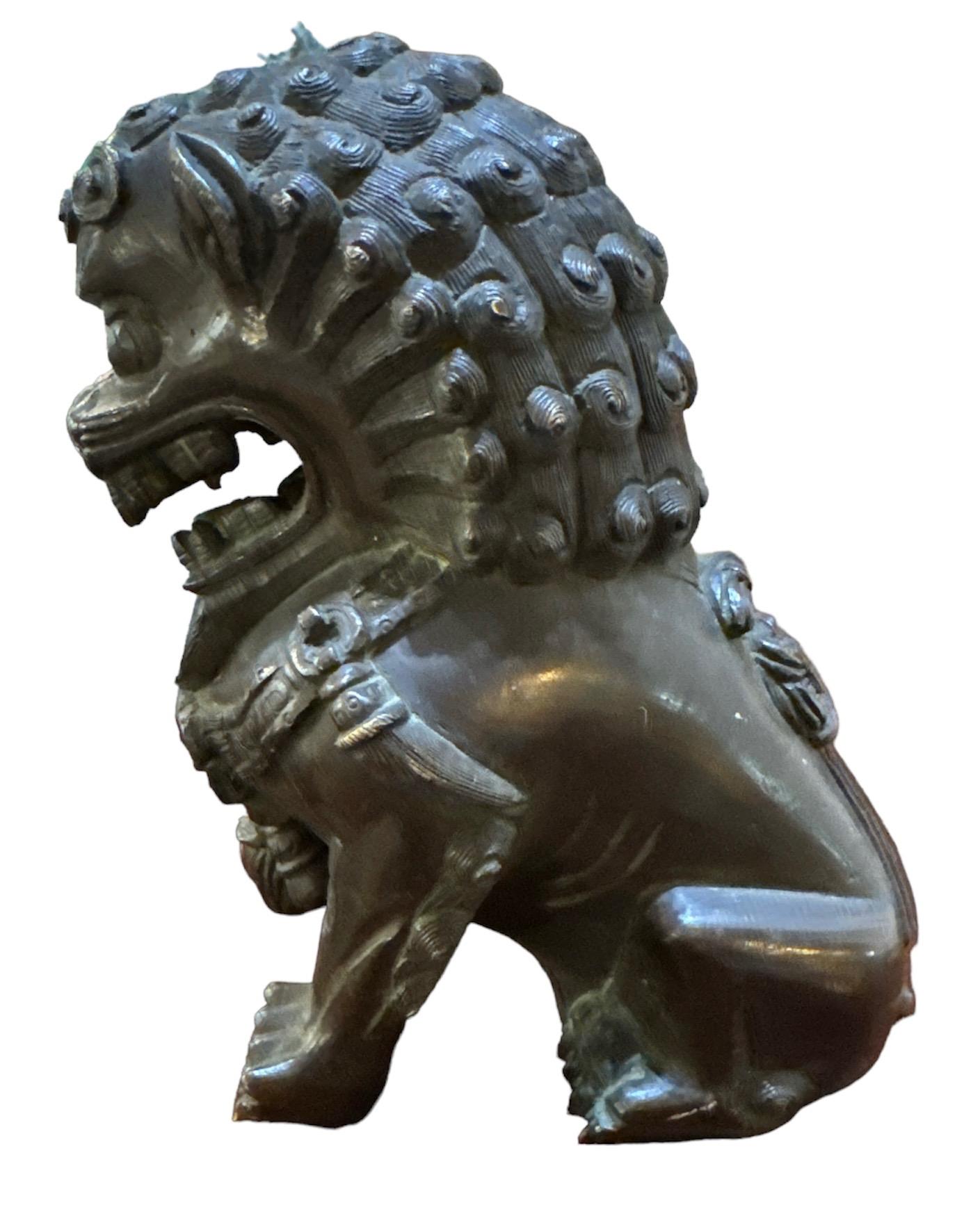 Antique Bronze Foo Dog. Wonderful age and patina from use. Measures 5.5h x 5.5w x 3.5w
