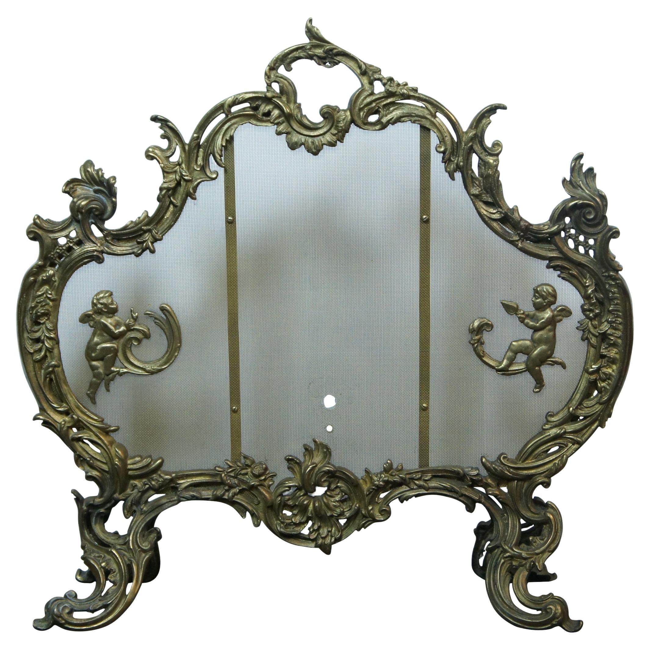 19th Century French rococo or baroque style bronze fire screen accented with cherubs and fender corners.

Screen - 28.25” x 8” x 28” / Fender Corners - 9” x 3.5” x 16” (Width x Depth x Height).