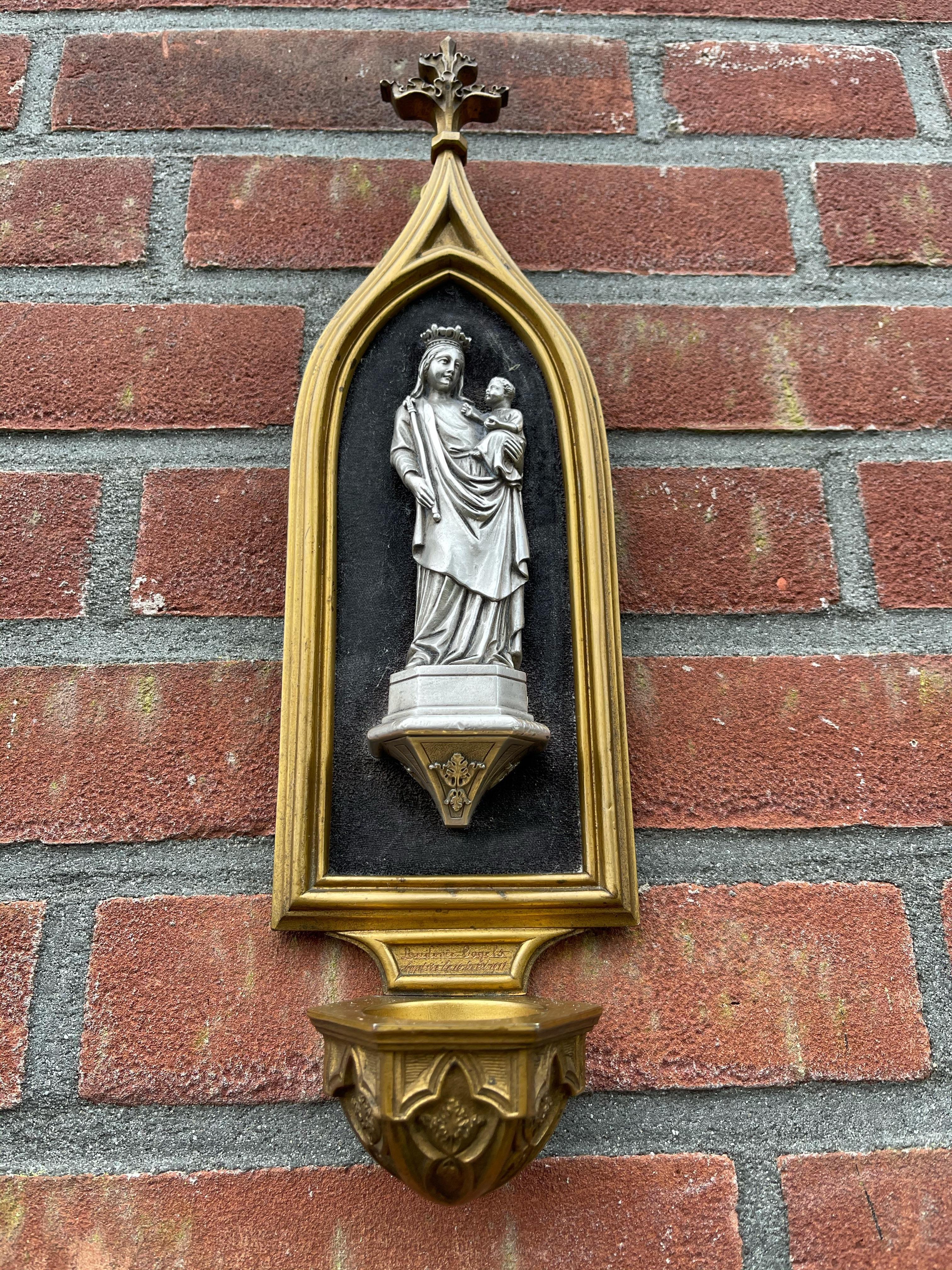 Great quality, Gothic Revival chapel wall plaque with holy water font. 

This antique work of religious art from 1911 is shaped like a Gothic chapel and it comes with an incredibly detailed, silver Mary and Child sculpture. This small but very