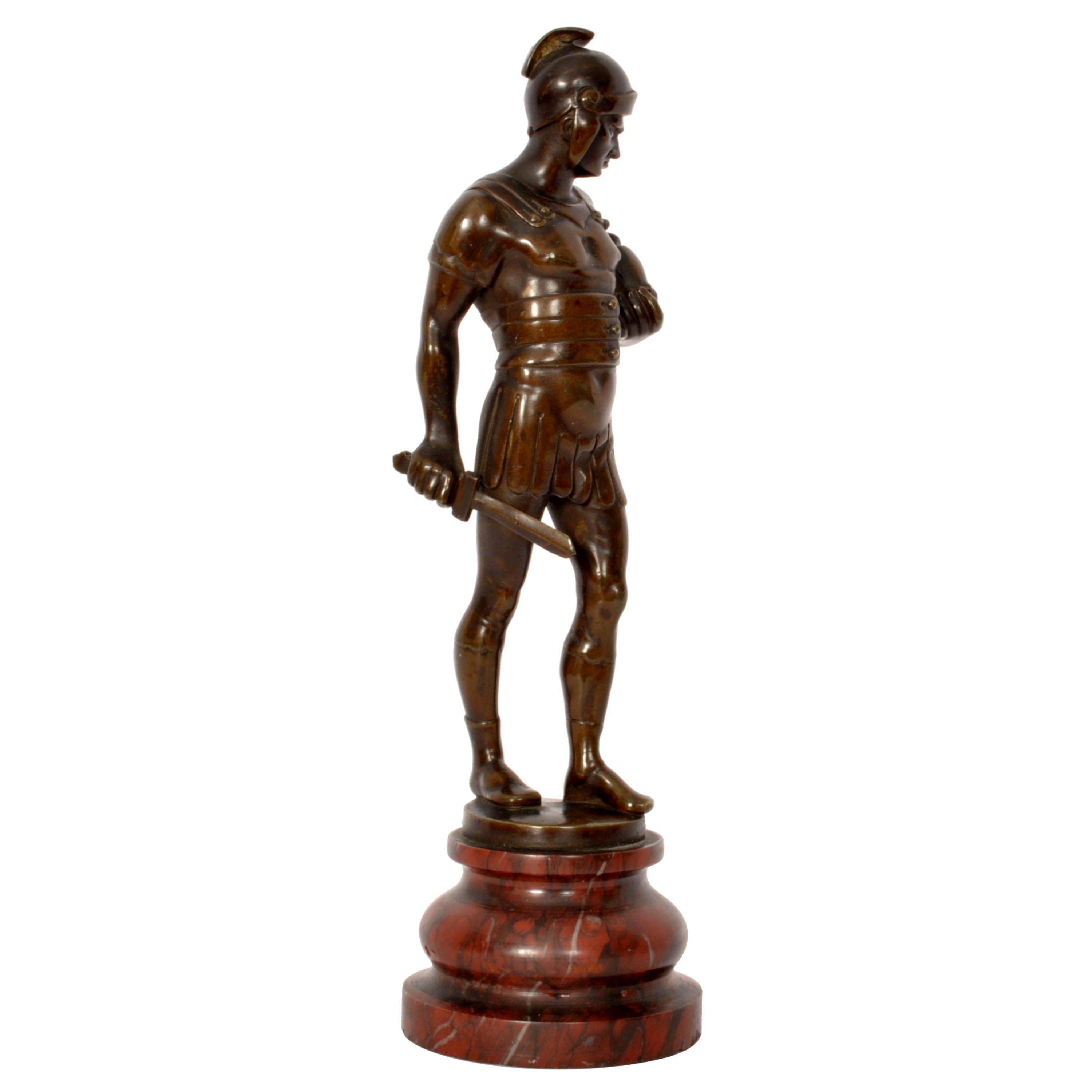 A fine quality antique Grand Tour bronze statuette of a centurion/gladiator, Italy, circa 1820.
This very handsome antique bronze was cast by the lost wax (cire purdue) method and portrays a centurion/gladiator dressed in armour, victorious in