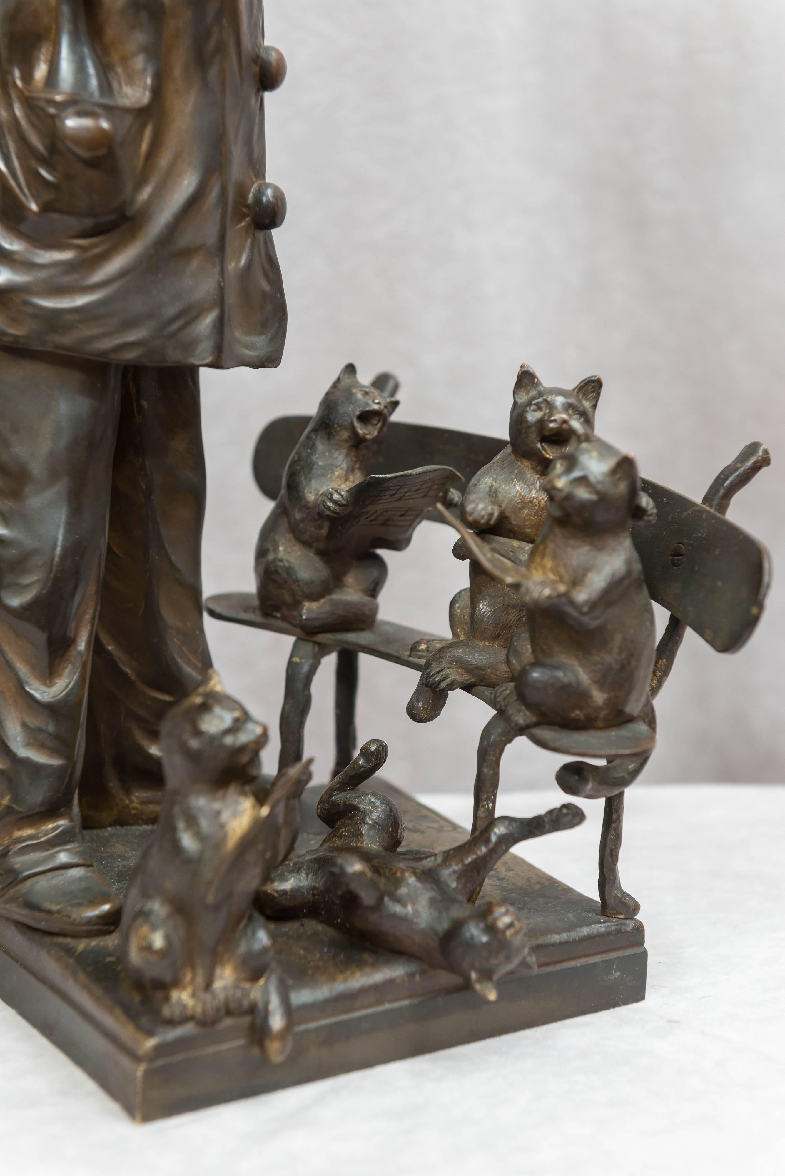 Patinated  Antique Bronze Grouping of a Pierrot Conducting Several Kitty Cats