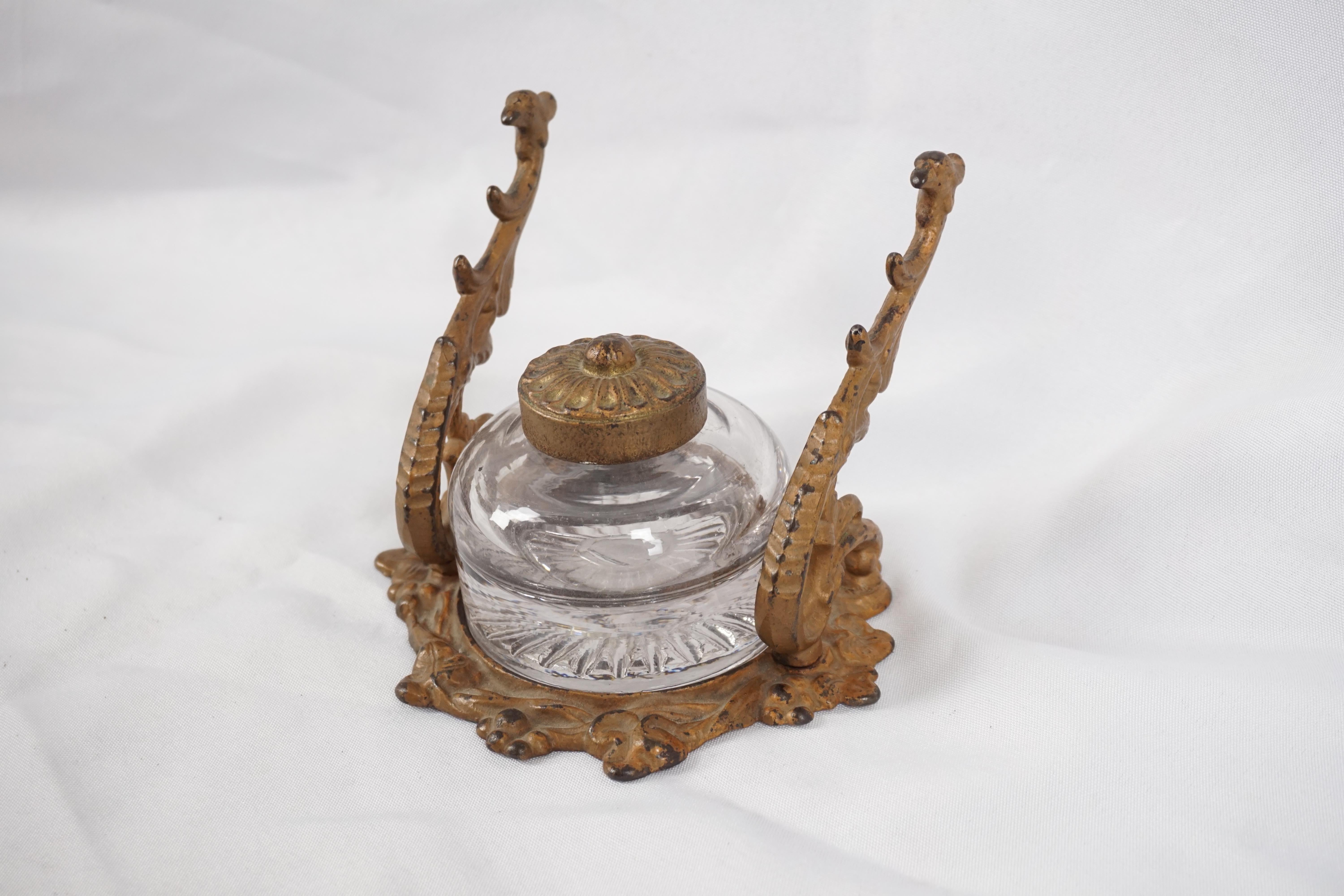 Antique bronze inkwell, Ormolu mounted inkstand, France 1890, H303

France 1890
Bronze
Bronze ormolu mounted inkstand
Pen rest to the sides
Brass inkwell with bronze cover
All sitting in a shaped base

H303

Measures: 5.5