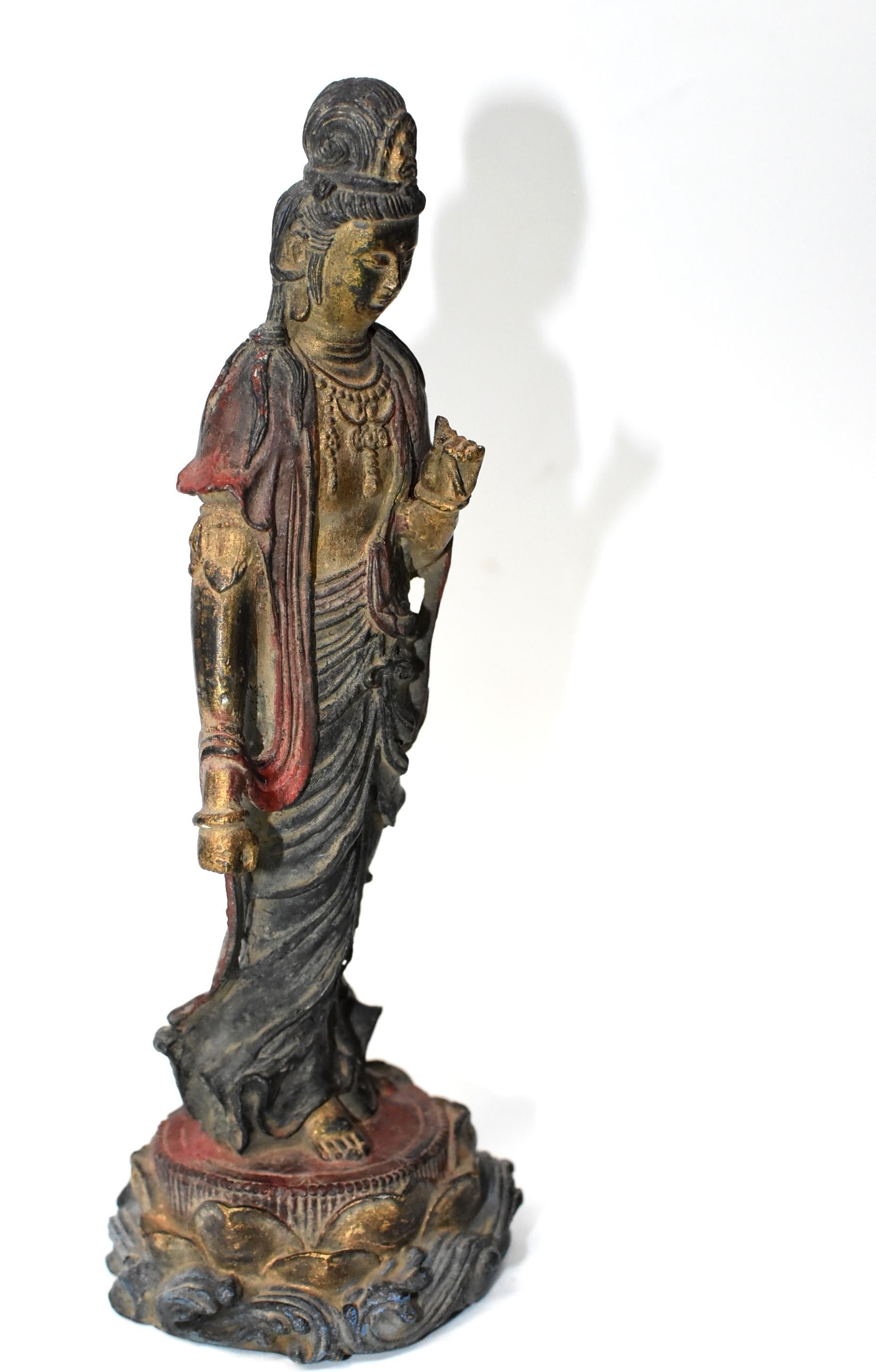 A small, fine example of standing Kwan Yin, one of the 4-piece 19th century collection we recently acquired. Kwan Yin is seated on a high lotus throne. Her robe is fluid and soft. She wears a necklace and wears her hair high. Her facial features,