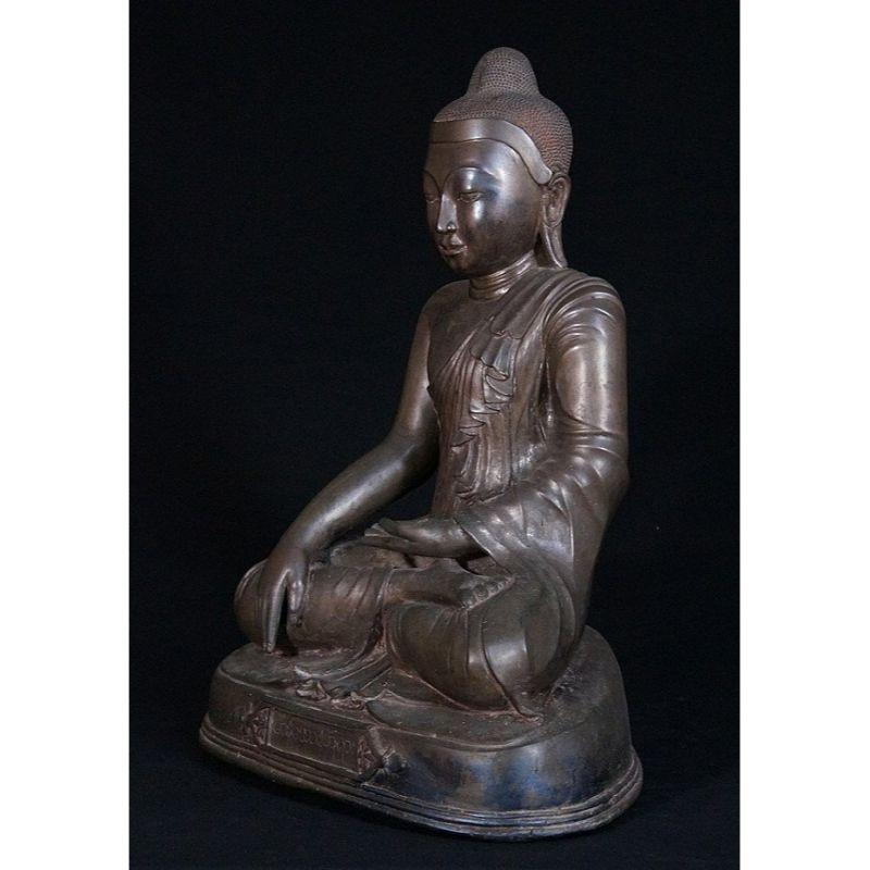Material: bronze
49 cm high 
Weight: 22.3 kgs
Mandalay style
Bhumisparsha mudra
Originating from Burma
19th century
Very special / dress !
With Burmese inscriptions, mentioning the name of the donor: Aung Man Aung.

